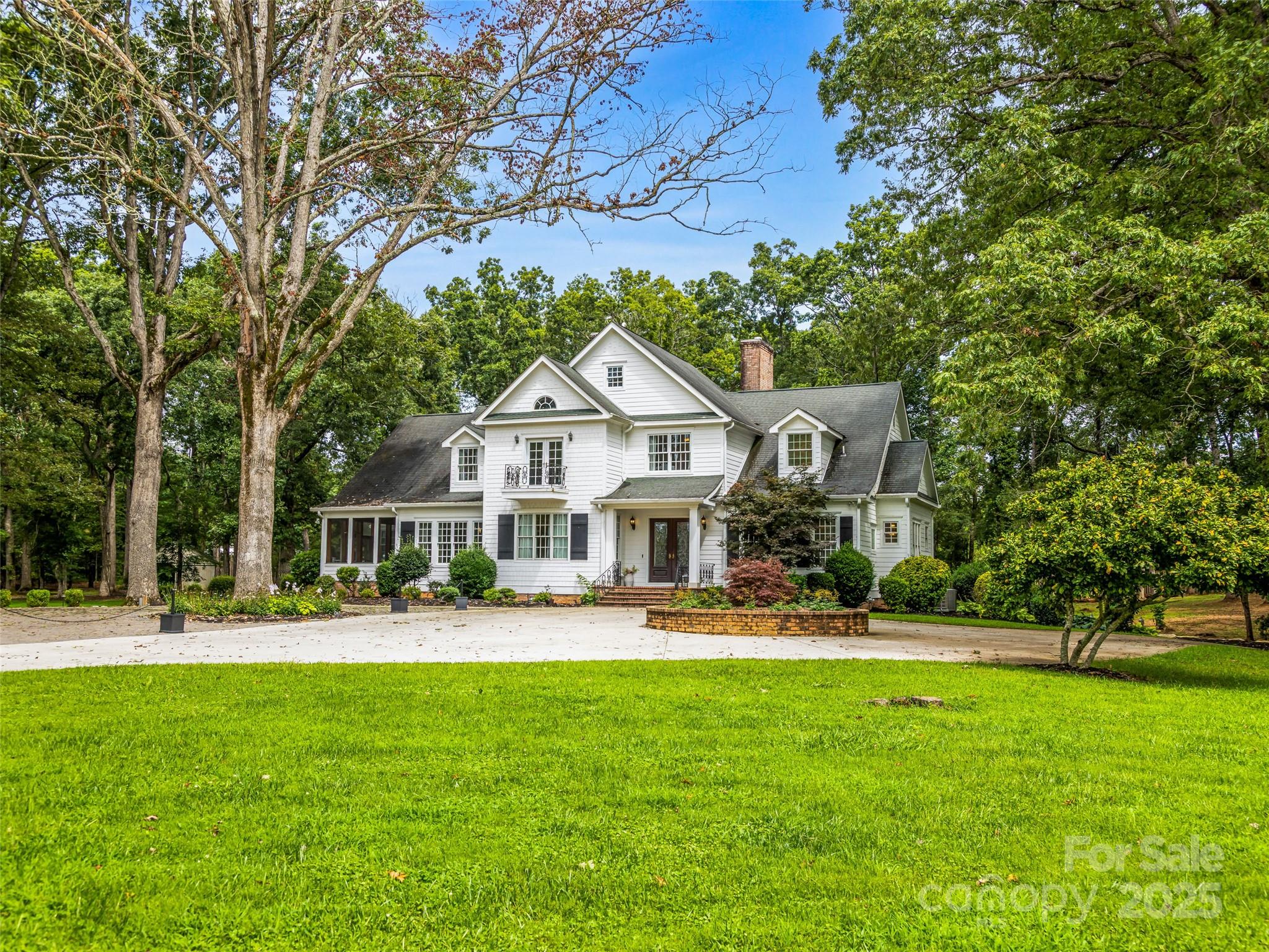 A Legacy Southern Estate Nestled in the idyllic Mills River Valley, this 30-acre estate captures the essence of Southern elegance with a touch of timeless romance. Shaded by a grove of ancient white oaks, the residence evokes the grandeur of a historic manor, blending refined architecture with the serenity of pastoral landscapes. Inside, a chef’s kitchen opens to a dramatic living room anchored by a bespoke fireplace mantel, setting the stage for elegant entertaining. French doors invite you outdoors, where rolling meadows, a charming cottage garden, and a shimmering one-acre stocked pond create a setting of unrivaled beauty. At the heart of the property stands a reimagined barn, now transformed into a sophisticated wedding and event venue. With its graceful proportions and rustic-luxe design, it offers a stunning backdrop for unforgettable celebrations under vaulted ceilings and soft ambient light. Whether hosting candlelit dinners by the water, welcoming guests to a sunset soirée under the oaks, or retreating into the quiet rhythm of country life, this estate offers a lifestyle steeped in charm.