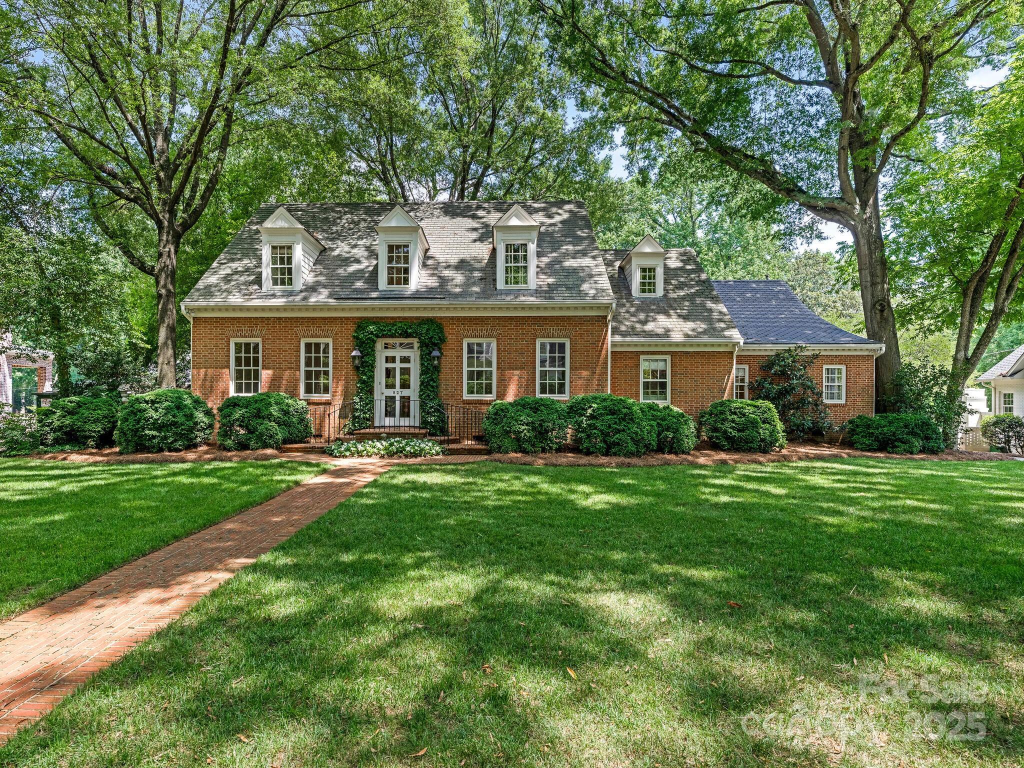 Prepare to be enchanted by the setting.  Charming curb appeal & exceptional location on one of Eastover most desirable streets.  Traditional floorplan with comfortable living spaces, oversized eat-in kitchen, guest bedroom on the main level, bonus room, screen porch & stunning flat yard (over .6 acre.)  Beautiful hardwood floors, handsome millwork, built-ins, recent interior paint  & new carpet. Attached 2 car garage, storage shed and gardening workshop provide ample storage. Easy walk to 3 area playgrounds, The Mint Museum, shopping and restaurants. 
Minutes to Uptown!