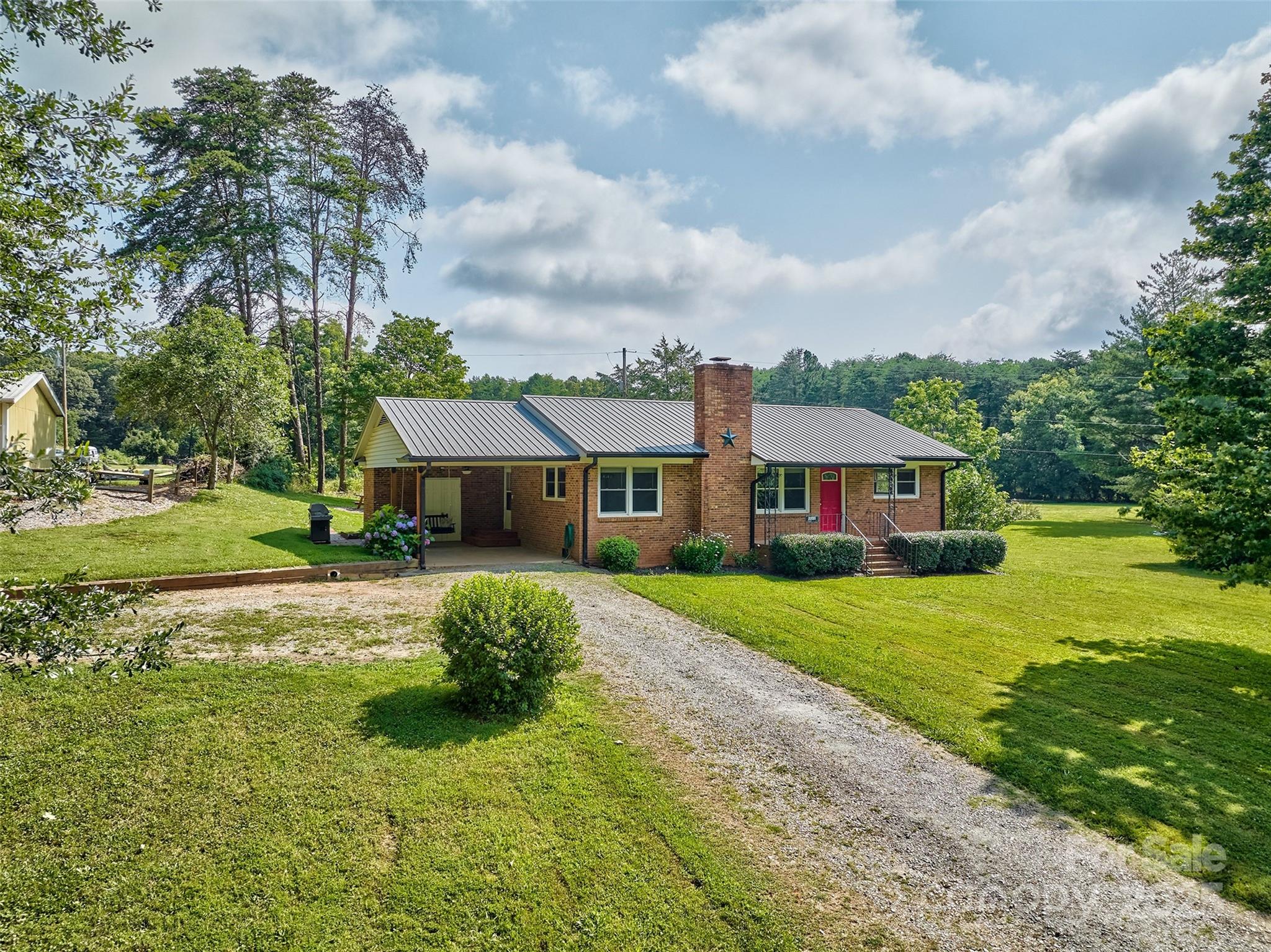 Come enjoy country living but close to everything!  And the lake!!  Beautifully remodeled and updated all BRICK RANCH close to Lincolnton and Huntersville and 2 minutes to the put in on the water.  Lots of counter space in the new kitchen and open floorplan.  The home offers 3 bedrooms and 1 bath and updated.  Carport could easily be converted to screen porch or enclosed garage.  Septic was pumped and inspected in 2022. Entire home freshly painted and all new flooring.  Out building for your storage needs and gardening tools.  Fire pit to enjoy the quiet evening.  Neighborhood offers all styes of homes and several new constructions, all on larger lots.  The building to the left of the home is NOT part of this sale.  Look for stakes to differentiate the 2 lots.  A pleasure to show and pride of ownership is apparent.  Welcome home!