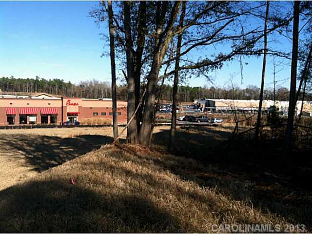 This 4.132 acre parcel has two parcel ID numbers in the Lancaster tax records: 0005-00-101.00 and 0005-00-101.01 in the rapidly expanding 521 corridor (between Ballantyne and Indianland).  Perfect for a bank, chain, restaurant or store, etc.. The parcel is zoned B-3.  2400 sq. ft. medical office on the property; occupied by a tenant on a month-to-month lease.