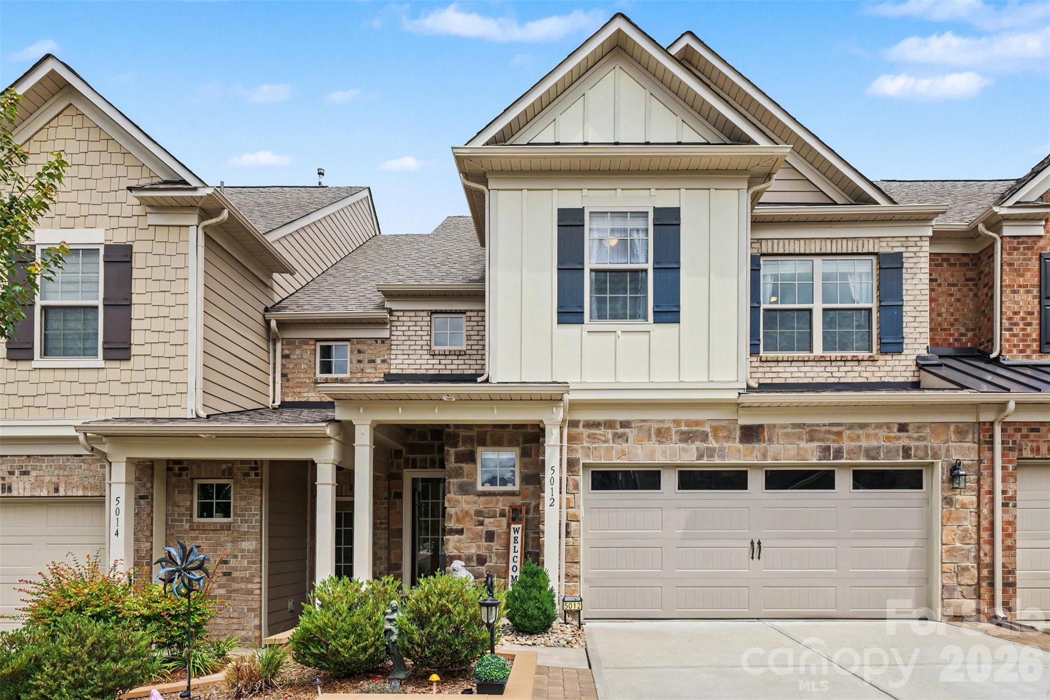 Honey stop the car!! This is a 3 bed/3 bath townhome in the desirable Bridgemill community, you must see! As you enter this well maintained property you will be greeted with upgraded LVP flooring throughout the main level. Next, you will find an Open Floor Plan which creates a perfect flow from the Living Room with floor-to-ceiling stone fireplace, and into the Kitchen with a custom pantry, gas stove, and stainless appliances. Tons of natural light awaits in the Sunroom, perfect for an evening drink! On the Upper Level you will find a Large Primary Bedroom with Tray ceilings, Huge Walk-in Closet with LVP flooring and California Closets, Tiled Primary Bath w/ walk-in Shower and double shower heads and Dual Vanities. You'll find the 2 Secondary Bedrooms are quite spacious and have their own full size bathroom with dual vanities. The extra large laundry room finishes the top floor. But don't skip the pull down attic with additional storage and shelving. If you are looking for the perfect private space to enjoy Carolina Nights, the fenced backyard with stamped concrete patio is perfect for gatherings with family and friends. HOA includes lawn care and access to neighborhood amenities—pool, clubhouse, fitness center, courts walking trails, & more—offering the best of low-maintenance living in a vibrant community! Location-Location-Location, with easy access to top-rated schools, the new Costco & Target, & only 5 miles to the new Ballantyne Bowl. Enjoy an easy stroll to the Butcher Shop, Coffee Shop, and Italian restaurant.