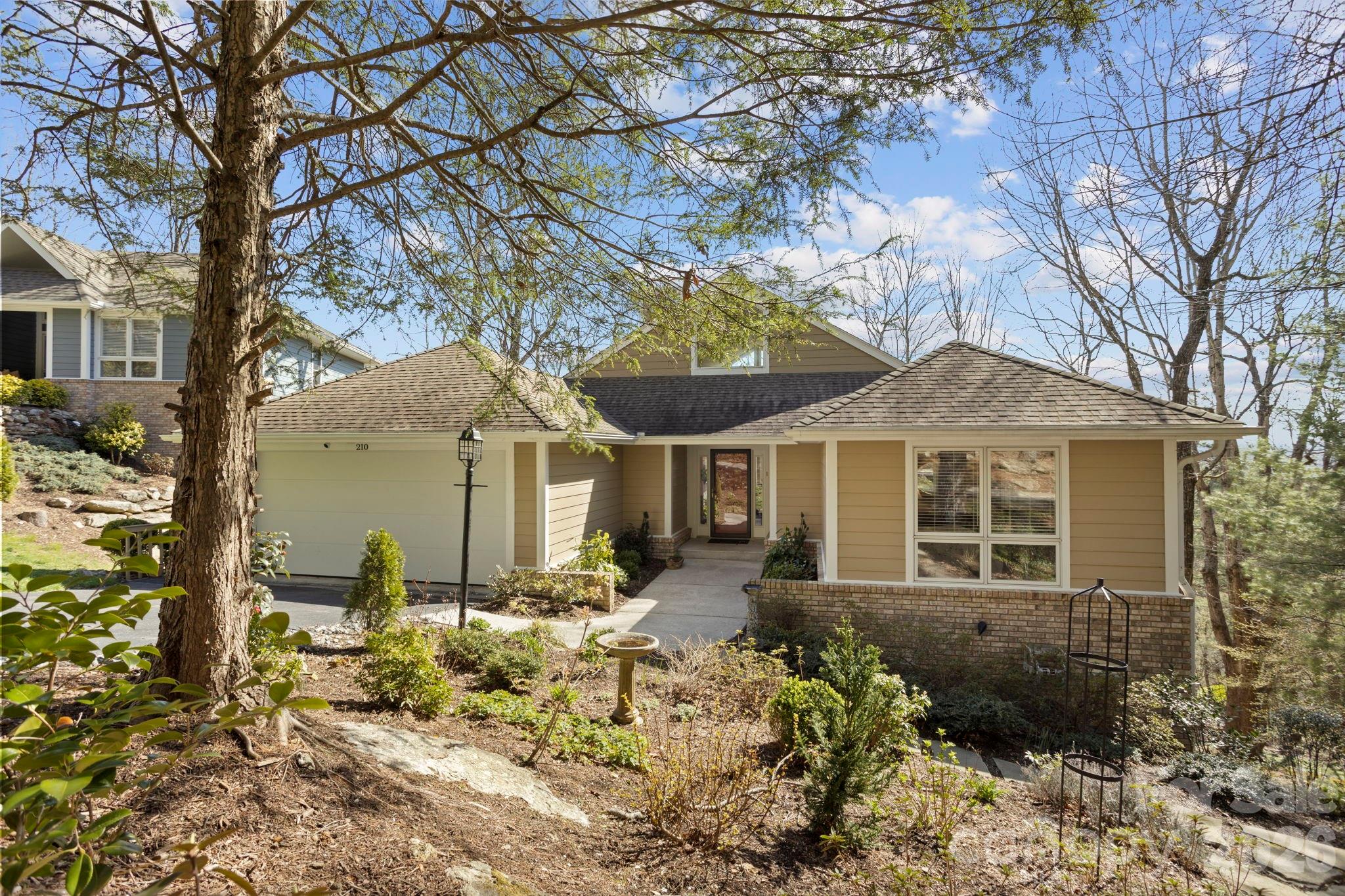 Beautiful Freestanding Villa in Brookwood Village –Located in highly desirable Kenmure, a prestigious gated golf course community. This beautiful three-bedroom, three-bath freestanding villa in Brookwood Village offers the perfect blend of comfort, style, and easy living. Designed for main-level living, the home features an open floor plan with spacious, light-filled rooms. The inviting foyer leads to a stunning great room with cathedral ceilings, a dramatic wall of windows showcasing the natural surroundings, and a see-through gas stone fireplace that also serves the dining room. Sliding doors open to a Trex deck, creating a seamless indoor-outdoor living experience. The dining room is enhanced by a large picture window, while the spacious kitchen offers granite countertops, tile backsplash, abundant cabinetry with drawers, stainless steel appliances, a breakfast bar with pendant lighting, a coffee bar area and pantry. A convenient grilling deck just off the kitchen makes outdoor cooking effortless. The primary suite is a relaxing retreat featuring multiple windows, a walk-in closet, and a well-appointed bath with double vanities, walk-in shower, and Kohler soaking tub. The main level also includes a guest bedroom, full bath with walk-in shower and laundry area. The lower level expands the living space with a family room featuring built-in desk and shelving plus direct access to the lower deck. A guest suite with walk-in cedar closet and en suite bath with double vanity and tub/shower combo, office area and a versatile bonus/flex room—ideal for hobbies or storage—complete this level. Enjoy peaceful outdoor living from both the main and lower-level Trex decks, surrounded by a private, natural setting. Additional features include a two-car garage with epoxy flooring, newer main-level HVAC system and numerous updates. Experience true low-maintenance living with the HOA handling exterior upkeep and lawn care. Ideally located with easy golf cart access to the clubhouse and amenities, this villa offers both convenience and lifestyle. A perfect opportunity to enjoy carefree living in prestigious Kenmure.