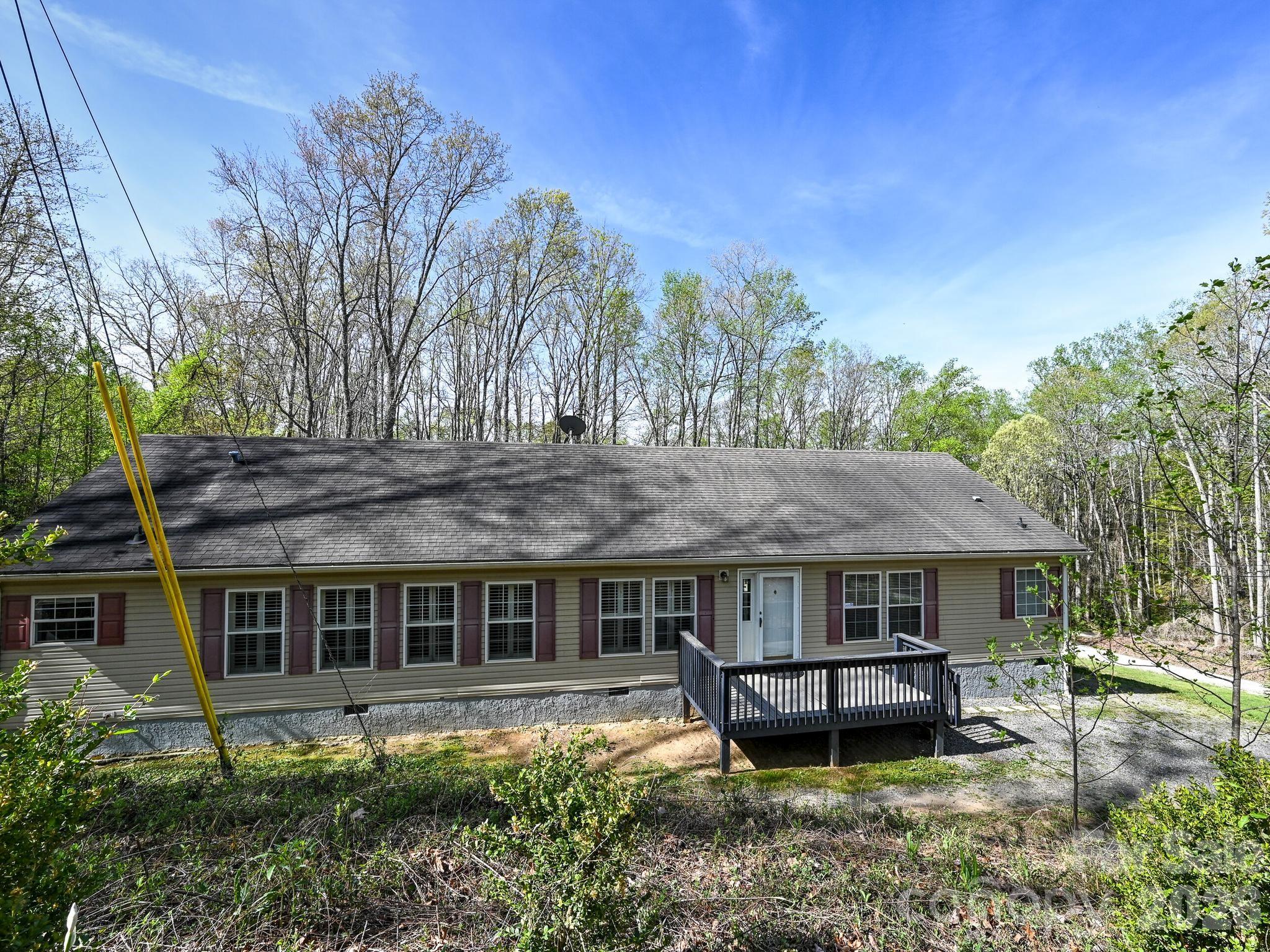 Spacious modular home on .97 acre rolling parcel. Split bedroom plan. Primary bedroom with 2 separate bathrooms, one has a 4 foot shower and the other a jetted corner tub. Walk-thru closet joins both bathrooms.
Primary bedroom also has a large deck overlooking the back yard. Great room and dining room combined with fireplace (current owners have never used). Bright kitchen with eat on bar, all appliances included, washer & dryer too! Crown molding throughout. Large bedrooms with walk-in closets.