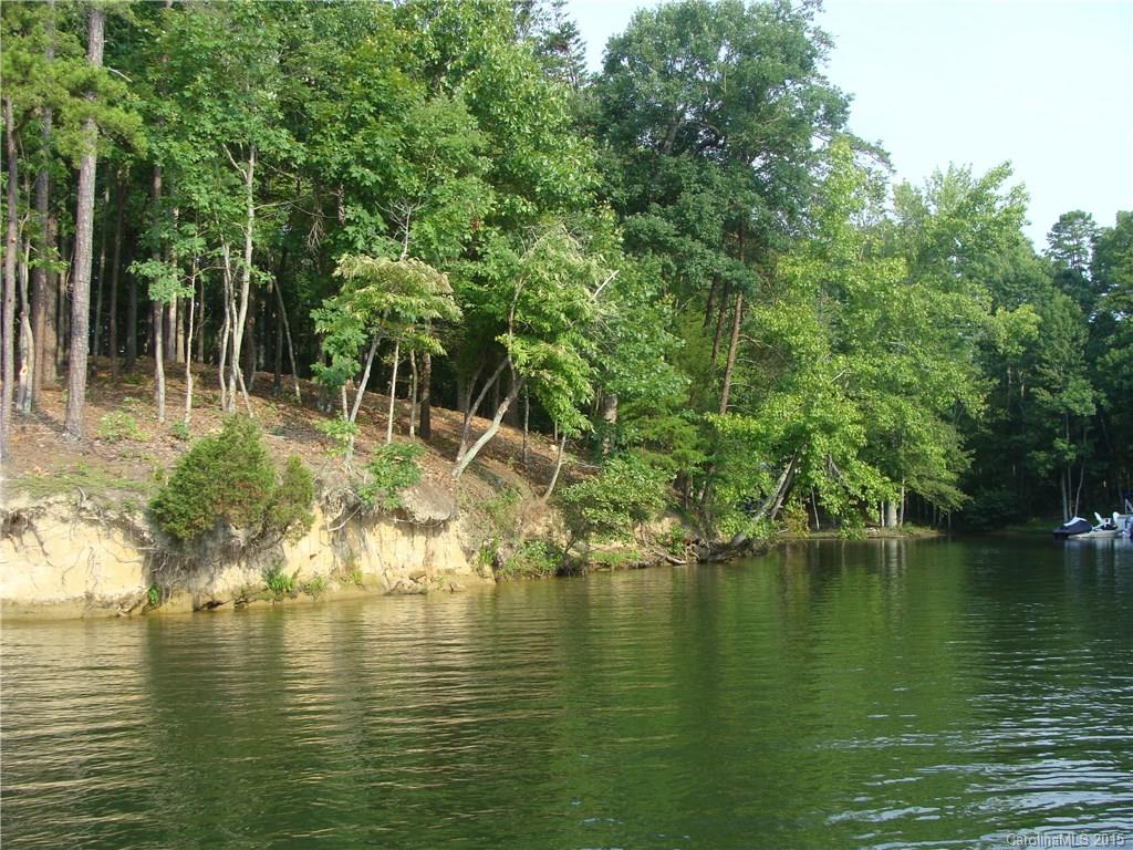 Where land ends life begins! Welcome to Kiowa Pointe- This waterfront home site on a cul-de-sac street is just
over 1.7 acres of wooded privacy with wildlife for you to enjoy. Dock permit has already been obtained allowing
you to build your dock in this protected cove just off the main channel. Build your dream home anytime, bring
your builder or use one of mine! Low taxes and award-winning schools with easy commutes to Charlotte, Gastonia, Rock
Hill and Belmont areas!