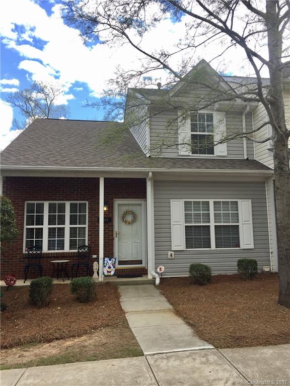 Fall in love with this stunning end unit Town home! Beautiful wood floors throughout the living area and kitchen. All tile bathrooms and laundry room. Like new carpet in bedrooms! Eat in kitchen opens up to a large deck with great wooded view. Family room has gas log fireplace with 2 story ceilings, beautiful wrought iron staircase railing leading to second floor. Upstairs hosts two bedrooms with a large full bath. In the basement enjoy a huge bedroom and walk-in closet, with a full bath!