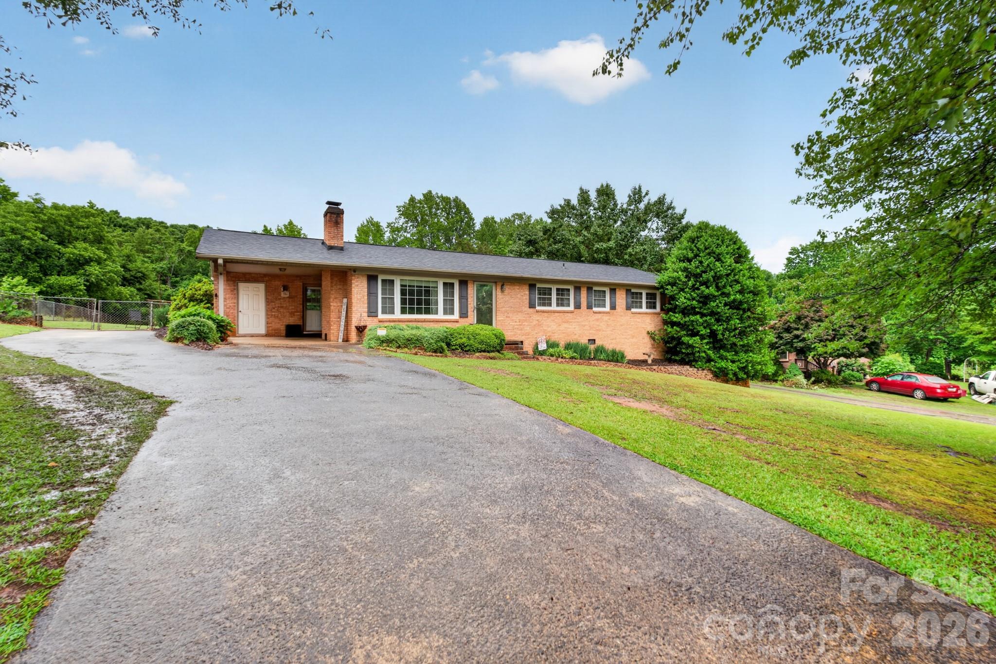 This beautifully updated, all-brick ranch home offers effortless single-level living on an expansive 0.73-acre lot. The interior features a sleek, updated kitchen with modern appliances, a welcoming dining area, a functional built-in office space, and beautifully renovated bathrooms with custom tiled shower surrounds.

?Major mechanical updates offer ultimate peace of mind, featuring a newer roof, HVAC system, mini-split, and hot water heater, as well as being fully wired for a generator. Outside, you'll find a convenient attached carport, a spacious, fully fenced-in backyard with a dedicated storage building, and a walk-in crawl space perfect for extra storage or easy maintenance access. This home perfectly combines modern interior updates, major mechanical reliability, and room to breathe!