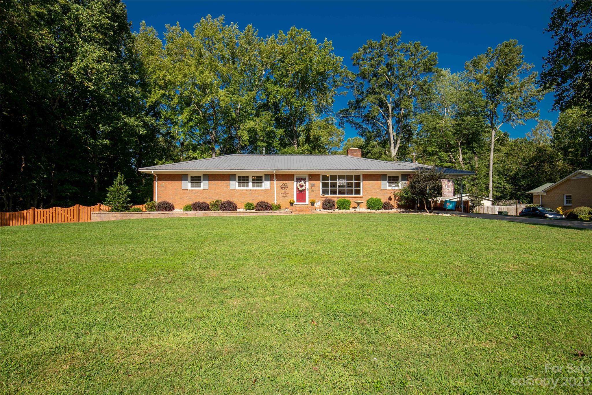 A remarkable home that captures your heart! This all-brick ranch style home boasts beautiful landscaping, a fenced back yard, whole home generator and plenty of natural light nestled in the charming and established Forest Hills neighborhood. With 5 bedrooms and 3 bathrooms over 1800 sqft on the main level and an additional 1300 sqft in the finished basement, with the option for an in-law suite or second living quarters, there's room for everyone. The outdoor space is perfect for grilling and unwinding on the spacious back deck after a long day. Plus, a metal roof, carport, and outbuilding complete the package. Located just minutes away from historic downtown York, restaurants, and local shops this home is ready to welcome its new owner. NO HOA. 2 rooms referenced as bedrooms in the basement do not have emergency egress.