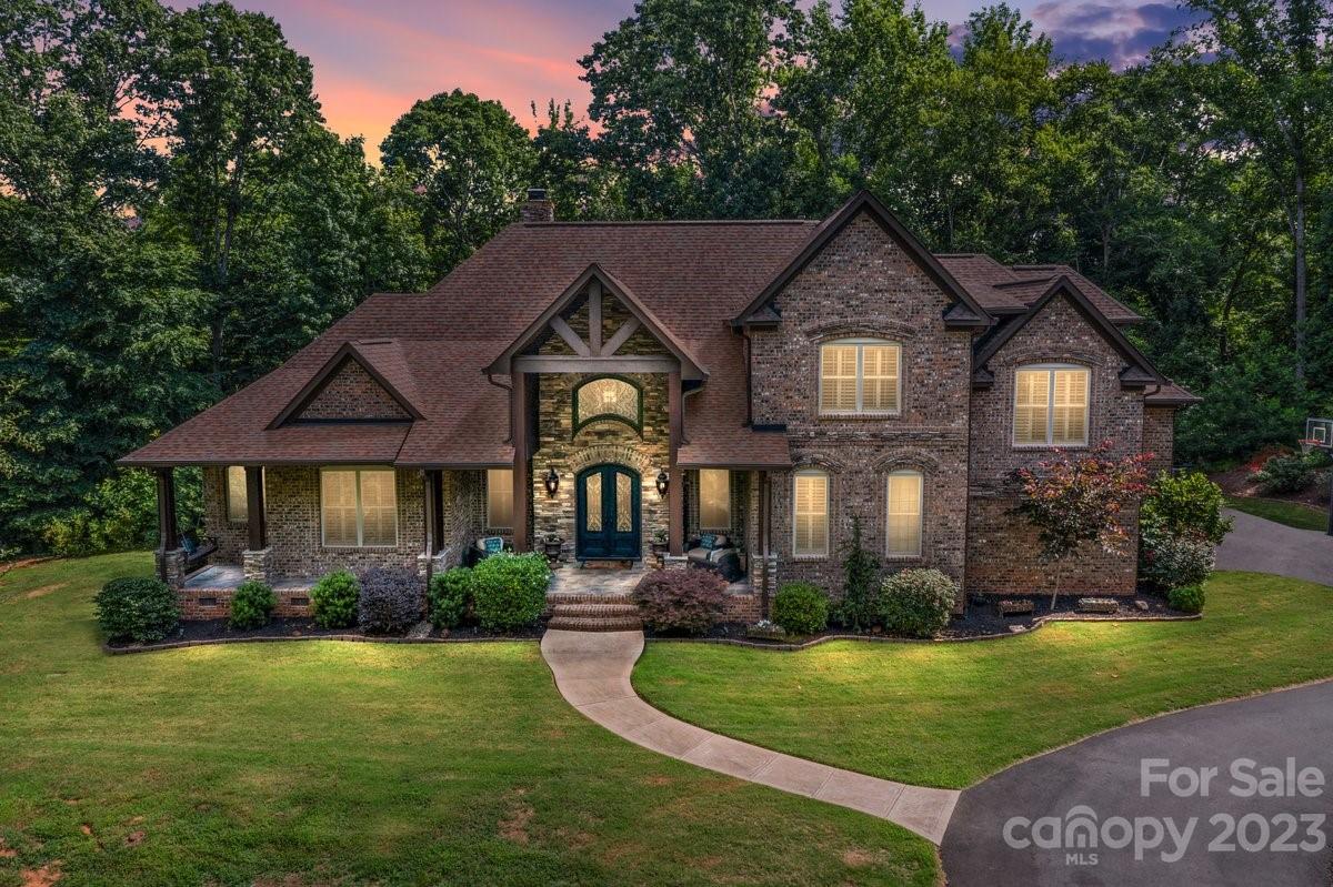 Stunning estate home built by Oz Custom on 6.5 acres of wooded privacy in Fort Mil. Drive down the winding driveway flanked by tall trees to this hidden gem that can't be viewed from the street. Complete privacy! Custom built, full brick w/finished basement offers something you can't find anymore. Primary suite on main. 2 sty great room. Kitchen features Wolf gas range, wall oven, warming drawer, 2 dishwashers, pot filler, wine fridge. Upstairs you'll find 3 large BRs, Jack n Jill bath, 3rd BR could be bonus. Finished basement could be 2nd living quarters w/2 potential BRs ensuite, huge family room/rec room, a kitchen area w/full size fridge, sink & dishwasher. All this opens to screen porch overlooking pool. Plenty of room to add addt'l 2 garage next to the home. Plus, build another 1500 sqft in law suite already HOA approved. Small HOA of 7 residents. H/W floors, central vac, trex deck, plantation shutters, surround sound in several rooms.