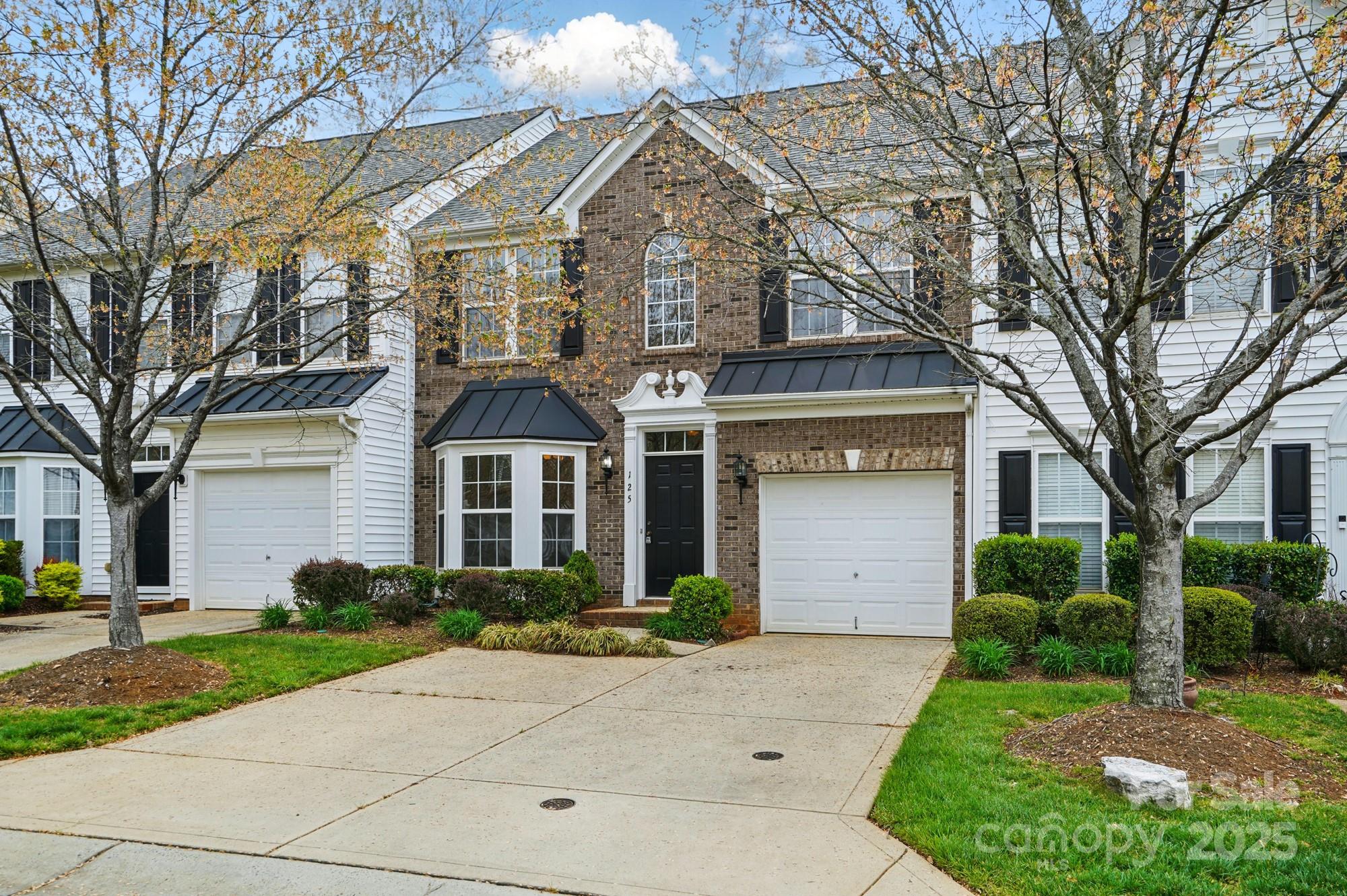 Welcome to your dream home!  This beautiful two story townhome perfectly blends comfort and functionality, nestled in the highly sought after Fort Mill area, just a stones throw from the vibrant Baxter Village and an array of shopping and dining options.  Step inside and discover a spacious layout with over 1800 square feet for unwinding and entertaining.  The formal dining room is ideal for hosting dinner parties and family gatherings, while the cozy breakfast area offers a sun lit spot for morning coffee or casual meals.  With three generously sized bedrooms and 2 1/2 baths, this home is designed for comfort and convenience.  The primary suite is a true retreat featuring not one but two walk in closets perfect for the fashionista!  Indulge in the en-suite bathroom equipped with both a separate tub and shower with frameless shower door, providing you with a spa like experience right at home. After market additions, radiant barrier, tankless water heater and more to create efficiency