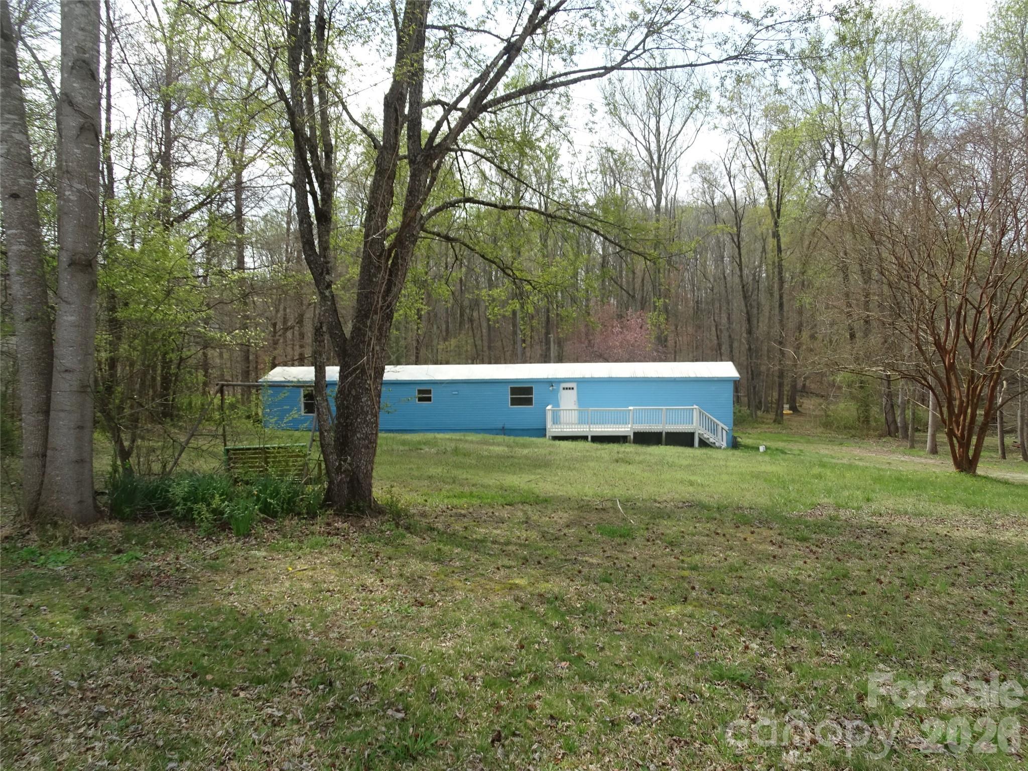 Looking for a weekend getaway, a vacation spot NEAR the lake, or add to your rental portfolio. This singlewide has a 1.54 acre lot with a lakeview from the back yard. Lake access is not that far away off of Hwy 8. Split bedroom floorplan, tile in kitchen, no carpet, large front deck. There is a storage building that will remain. Cooled by WINDOW UNITS. "Selling as is" New tax value will be 179,200. Back portion of the lot is in the flood zone, due to being at the lake. The boat launch area is 3.6 miles away or approximately 7 minutes away to the Wildlife Recreation access. (Photos of the boat launch area at the lake are located at the last of the photos) THERE IS NO LEGAL ACCESS TO THE LAKE FROM THIS PROPERTY. CASH OR CONVENTIONAL LOANS ONLY. AGENTS PLEASE "READ" agent only