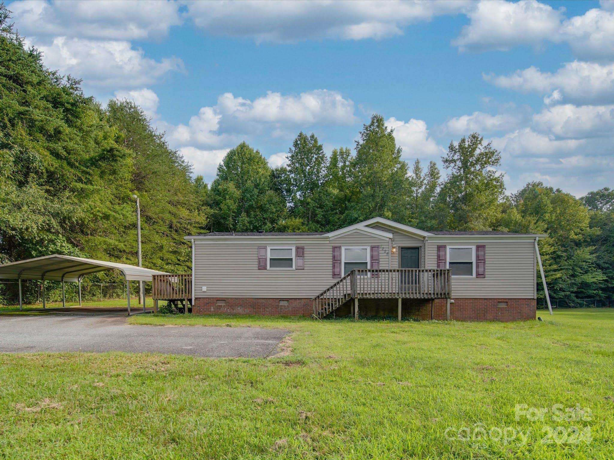 Back on market, buyer could not perform. Serene country setting yet minutes to downtown. This fixer is waiting for your personal touch. Step into the living room that opens to the dining and kitchen. Kitchen features ample cabinets and appliances convey. Split bedroom floor plan. Primary offers a walk-in closet and on suite bath. The large yard includes a detached carport and storage shed. Clover school district and York County taxes. Offered as-is, seller will not make any repairs.