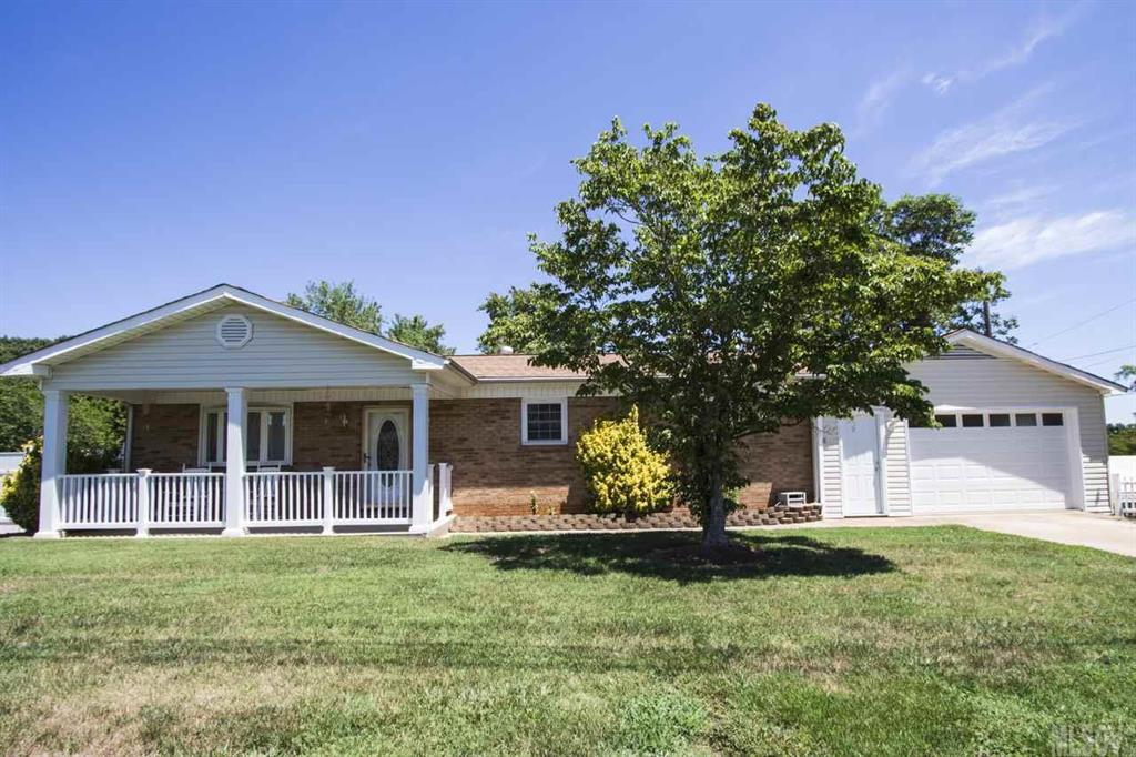 Gorgeous, fully updated home featuring charming details-custom mason jar lighting, quartz countertops, original hardwood floors and an AMAZING level and sprawling backyard! No details have been missed! Large kitchen with stainless appliances flows into a spacious dining area, accented with beautiful wainscoting. Open floor plan continues into the living area featuring plenty of sunshine and a gas fireplace with stone details.  Bathroom is spacious w/ luxurious details. 2nd driveway opens into HUGE carport/basement/storage areas, perfect for storing vehicles, etc.  Deck overlooks a quiet and sprawling backyard, surrounded by mature trees.  Desirable Conover location with ample outdoor space! A must see!