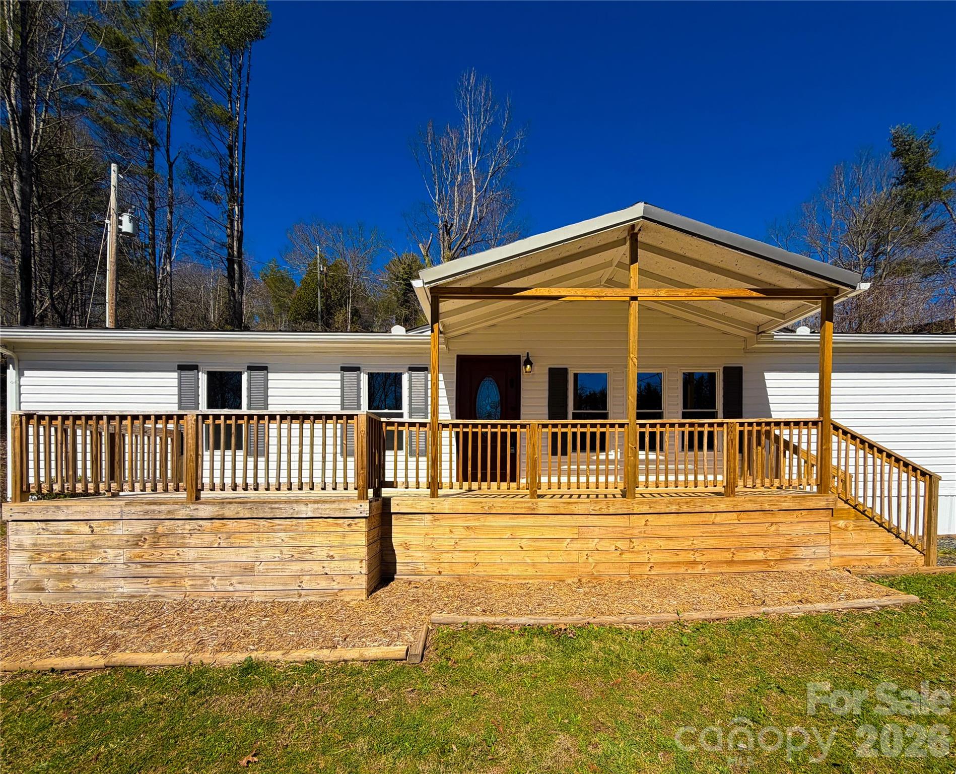INVESTOR SPECIAL: Seller needs to sell! Brand new HVAC system installed in 2025 and cabin like interior for the perfect mountain getaway. Enjoy mountain and river views right outside your front door. Two private lots totaling a full acre of land with a good mix of open use flat yard space and gently sloped land that would be ideal for livestock, terraced gardens or a natural mountain landscape. The knotty pine walls create a warmth that only amplifies the wood-burning stove in the den. Conveniently located between Burnsville, NC and Spruce Pine, NC, yet tucked away from the hustle and bustle. If you're looking for a natural playground, why not head down to Mount Mitchell or the South Toe River only a short drive away? This home is an ideal investment, second home or natural mountain retreat that offers the ultimate balance of tranquility and convenience. The home is on a shared spring with no "official" shared spring agreement.  Contact listing agent for a quote on having a private well dug.