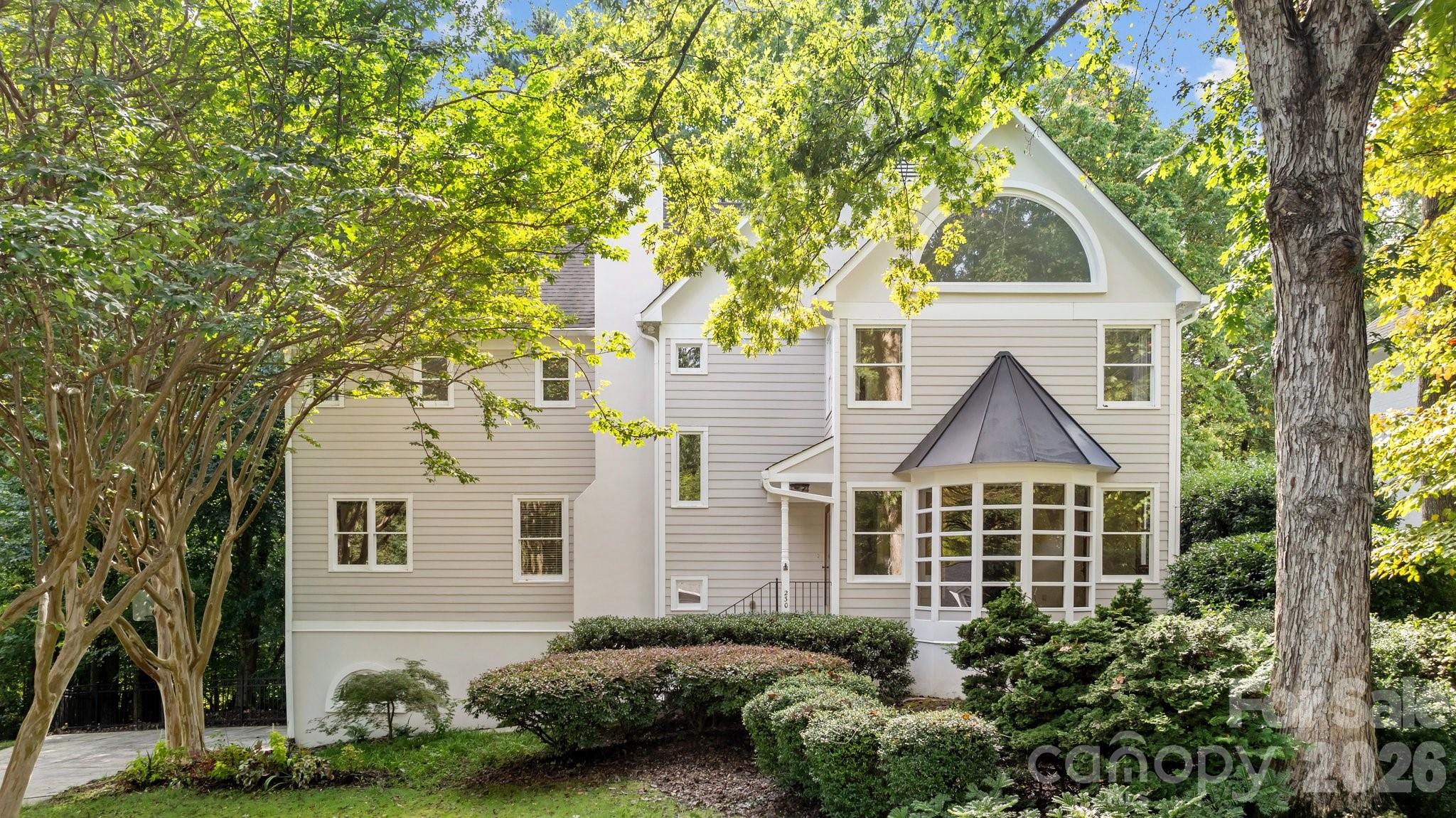 Exceptional custom-built home tucked at the end of a quiet cul-de-sac in the heart of highly sought-after Sardis Woods. With approximately 3,700 SF of heated living area across four thoughtfully designed levels, this is the kind of space — and craftsmanship — that simply cannot be replicated in today's Charlotte market. Featured in the 1987 Parade of Homes, this residence was built to impress and has only grown more timeless with age.
Main Level – Crafted for Entertaining:
Rich hardwood floors and crafted wood trim set the tone from the moment you enter. A welcoming living room is anchored by a distinct floor-to-ceiling bay window, flowing into a formal dining room, updated kitchen with modern appliances, and a breakfast bar that opens into a warm family room with a cozy fireplace. An adjacent sunroom/office provides a serene retreat. Soaring 9–10+ foot ceilings throughout add an airy, elevated feel, and a centrally located half bath serves the entire main level with ease. Two brand-new HVAC units ensure year-round comfort and peace of mind for years to come.
Upper Level – Spacious, Light-Filled Bedrooms:
Four generously sized bedrooms each offer ample natural light and closet space. The showstopping primary suite features dramatic cathedral ceilings, a stunning half-moon window, and a luxurious ensuite with dual walk-in closets, a private water closet, an extended vanity, step-in tiled shower, and a soaking tub — all bathed in natural light with custom windows framing wooded views. A second full bath serves the remaining bedrooms.
Third Level – 5th Bedroom / Bonus Room | 712 SF:
The top level delivers 712 SF of flexible living space — two windows, great ceiling height, and a layout naturally divided by a short hallway into two distinct areas. Use it as a true 5th bedroom, a guest suite with a sitting room, a home gym and hobby space, a media room, or a combination of all of the above. Rarely does a home offer this kind of flexibility.
Lower Level – Garage Entry:
The partial below-grade entry level provides direct access to the side-load two-car garage — thoughtfully positioned to preserve the home's stunning street-facing curb appeal — along with a landing and stair access to the main level above.
Outdoor Living & Curb Appeal:
A large front yard set well back from the street creates exceptional privacy and presence. An extended rear deck is perfect for entertaining, with a low-maintenance backyard nestled among mature trees.
An Even Better Location:
Sardis Woods is one of Charlotte's most beloved neighborhoods — tree-lined streets, architecturally diverse homes, and true community character, just 10 miles from Uptown. Minutes from Charlotte Christian School and Providence Day School, two of the city's most prestigious private institutions. Close to McAlpine Creek Greenway, multiple parks, Galleria Village, and South Park Mall.
Space like this, craftsmanship like this, in a neighborhood like this — it doesn't come along often. Schedule your private showing today.