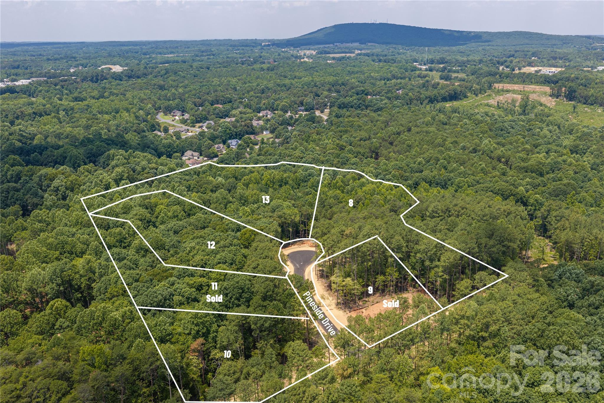 After much anticipation the Preserve at Grassy Creek Phase 2 is ready!  With only 13 wooded lots available ranging from 1 acre to 3.2 acres, privacy abounds in a subdivision where you can get out and walk your dog, soak up the peace found off the beaten path yet be a short drive to anything you desire!  Lot 10 is perched up a bit higher than the other lots and located on the corner of Pineside Drive and Pine Creek Drive.  Sitting at 1.12 acres with a lovely flat spot for your home and already perk tested for a 4 bedroom home this location will help set the tone for the neighborhood.  The Preserve at Grassy Creek- Phase 2 (Denver, NC) is located about 30 minutes from Charlotte Douglas Airport, 40 minutes from downtown Charlotte and just minutes from shopping, restaurants, breweries, doctors offices and of course coffee shops!  Also to note a new gas station is coming soon to Hwy 16/150 intersection as well so it will be easy to fill up on your way to Hwy 150 or when you jump on new Hwy 16 to shoot to Charlotte.  This area is booming, don't delay and schedule a private tour today!  

Underground utilities will be installed soon.  Minimum 1800 sq ft to build.