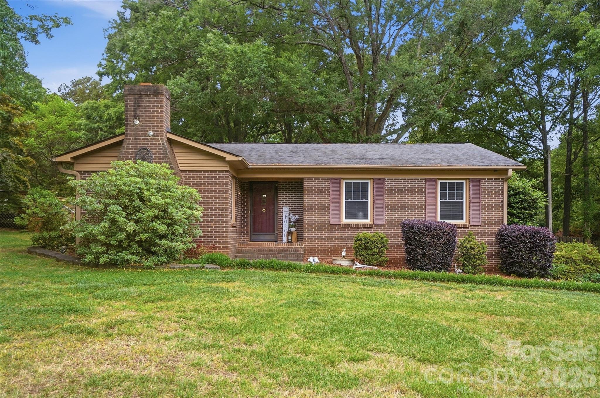 Price Reduction!!!  Take a look at the new price and take another look at this property!!!  Location! Location! Location! Minutes from Hwy 74 to head to Monroe, Charlotte, the By Pass, or 485.  Full brick 3 BR, 1.5 BA Ranch with Spacious Living Room, Updated Kitchen, and dining area.  Freshly painted in neutral, to go with any decor.  Many extras including an oversize patio, firepit, free standing deck, fish pond, and huge shed with some closed storage and some open.  Lot is massive (2.05 ac), with tons of road frontage and goes back 546 linear ft deep.  Lot goes well past the shed with flower beds or planting beds too many to count.  327 linear feet of road frontage.  Hot Tub is negotiable.  Appliances stay including kitchen appliances and washer/dryer.  Potted plants outside will go with Seller.