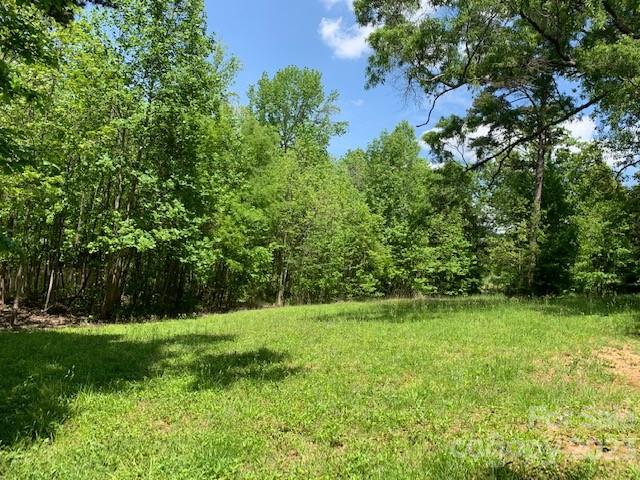 Rare opportunity 1.955 Acre Lot with Pond in the city. Waiting for build your dream home. Close to I85. Access to city water and sewer. Possibly will need to be rezoned according to the usage. This would be a wonderful location for townhomes if zoning permits.