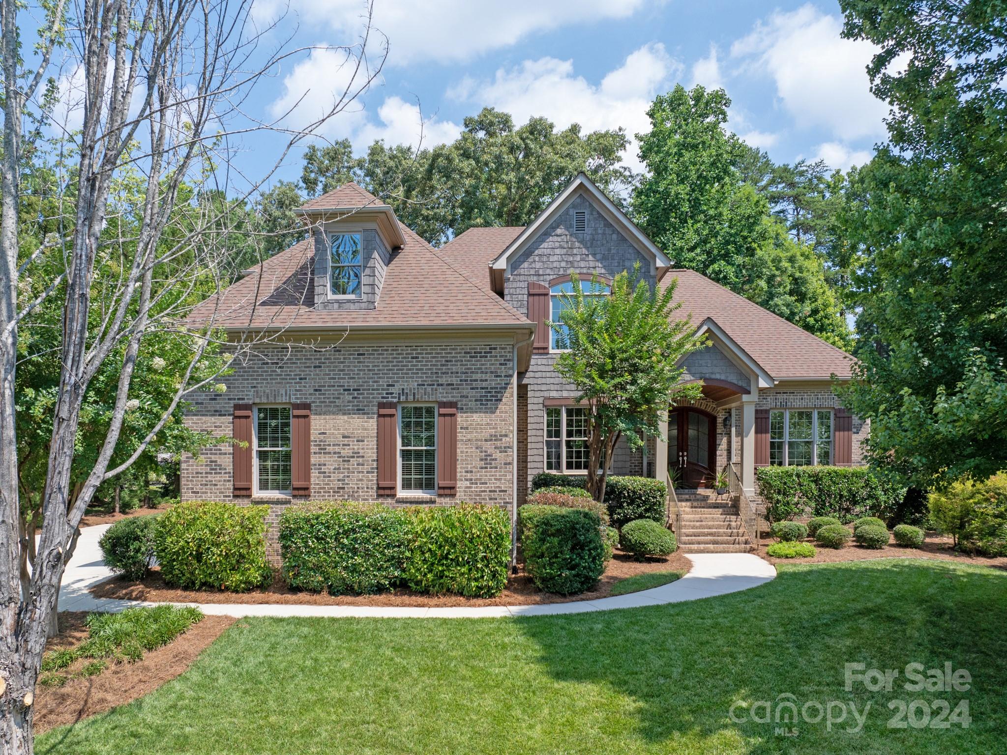 A wonderful opportunity to own a Custom home in the highly sought after Springfield Community (Fort Mill, SC). Home boasts an open floor plan that graciously flows through all areas and yet a quaint and cozy feel for everyday living. You are greeted by Custom built in Cabinetry; warm hardwood floors; extended moldings; arched doorways & trim throughout and that showcase the richness and warmth this home has to offer. Lower maintenance w/Full brick & Cedar accents; usable backyard space; & 3 car garage. Primary bedroom on main level and difficult to find (4) add'l bedrooms PLUS a spacious bonus room over garage upstairs. Springfield Amenities include:3 pools; Pocket Parks;walking trails/sidewalks throughout;Active Community w/several fun & engaging events throughout the year;5 Tennis Courts;2 Pickleball; Playground; entertaining areas w/in the Clubhouse & Pavillion.Seperate membership req'd for the Springfield 18 hole Public Golf Course. MOVE RIGHT IN to this stunning home!!!