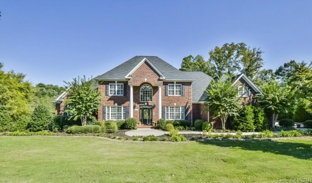Elegant estate custom home nestled on expansive private wooded setting with vista golf course views from the front door!   Beautiful pool with travertine patio & professional landscaping.  Grand millwork & plantation shutters throughout. Master & Guest/Study Suites on main level.  Chef’s Kitchen with entire Pantry Room!  Huge versatile Bonus Room.  Incredible 2 level walk in attic storage.  Central vac.  Excellent central location.  Everything you are looking for, plus more!