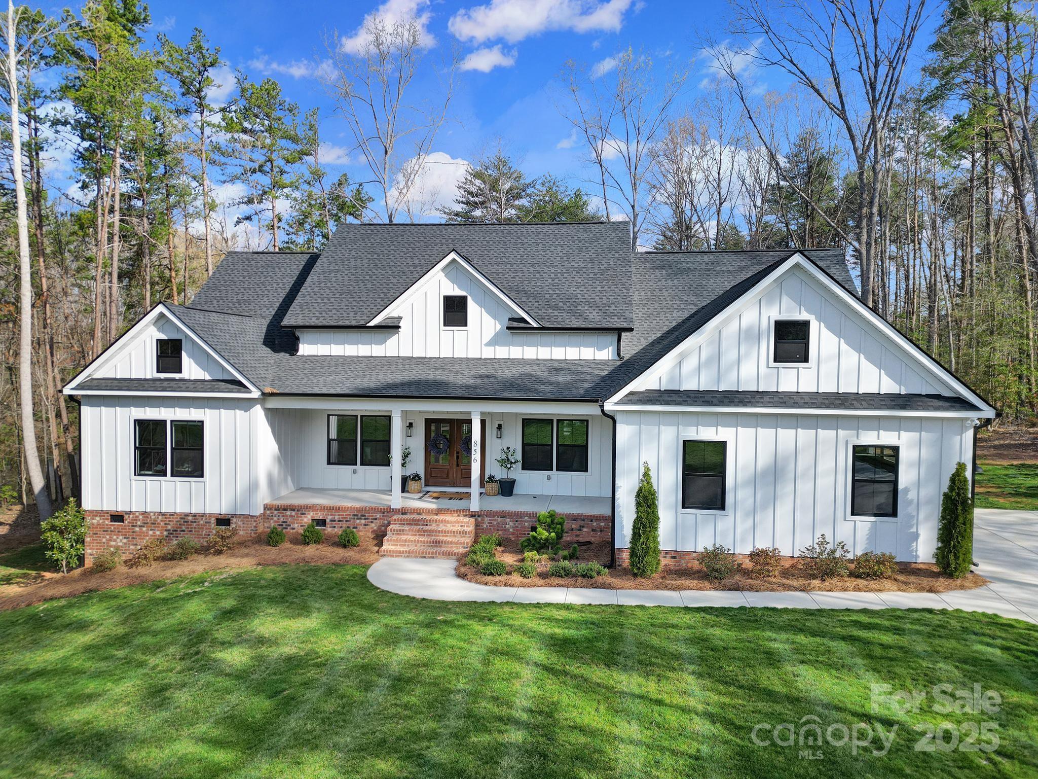 Welcome to picturesque Irongate Farms in Clover, SC! This stunning rustic Craftsman home, built in 2023, features 4 bedrooms and 3.5 bathrooms, nestled on a scenic pond with breathtaking water views in an idyllic country setting. Step inside to an open floor plan that blends the spacious gourmet kitchen, great room and dining area. Soaring vaulted ceilings with beautiful, custom wooden beams adorn both the kitchen and great room. The kitchen boasts a spacious island, sleek stainless steel appliances and smooth countertops. The luxurious primary suite on the main floor features a spa-like bathroom with opulent finishes for the ultimate retreat. Outdoors, relax or entertain on the expansive terrace or covered porch.  Enjoy fishing on the fully stocked pond.   Set on over an acre of private land, this estate offers elegance, seclusion and sophistication in one of Clover’s most coveted communities.