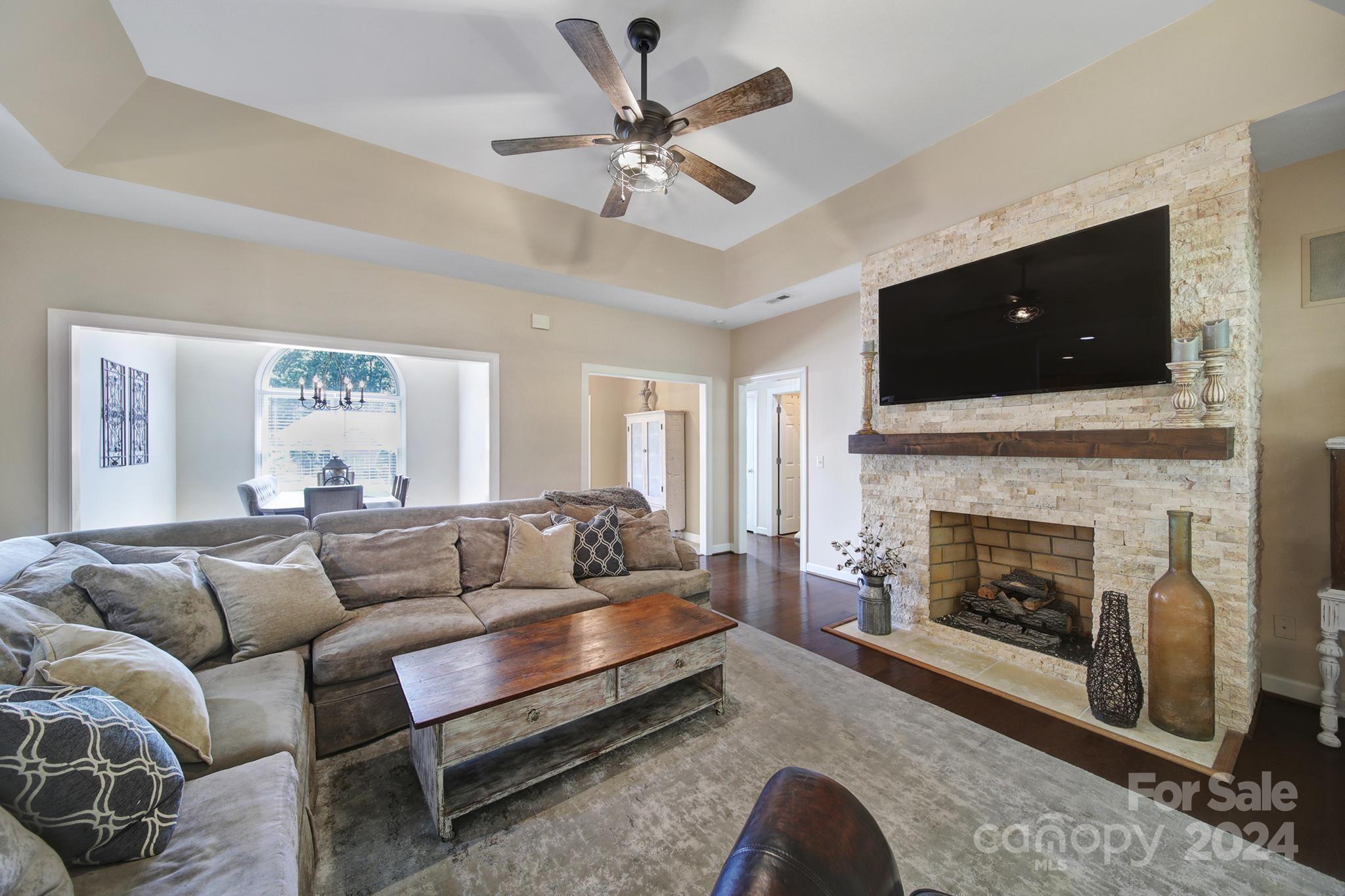 One level living at it's best! Welcome home to this 3 BR/2 BA beautifully updated custom built, full brick, home! Once you drive up sloped driveway, you enter oversized, flat, 2-car garage. Upon entering home, you will be greeted by a spacious foyer w/stone flooring. The formal dining w/hardwood floors & the family room w/trey ceiling, brick fireplace, surround sound & hardwood floors adjoin foyer. The kitchen w/stainless steel appliances, double sink, abundance of cabinet space, breakfast bar & breakfast area located just off family room. Access to spacious laundry room w/build in cabinets & access to large 2-car garage from the kitchen. The large primary bedroom with tray ceiling gives way to a lovely primary bath boasting jetted tub, shower, double sinks, private lavatory & large walk in closet. Two secondary bedrooms & another full bath finish out interior living space. Out back, enjoy the large screened porch, the deck & large private yard! New HVAC, Hot Water Tank & newer roof!