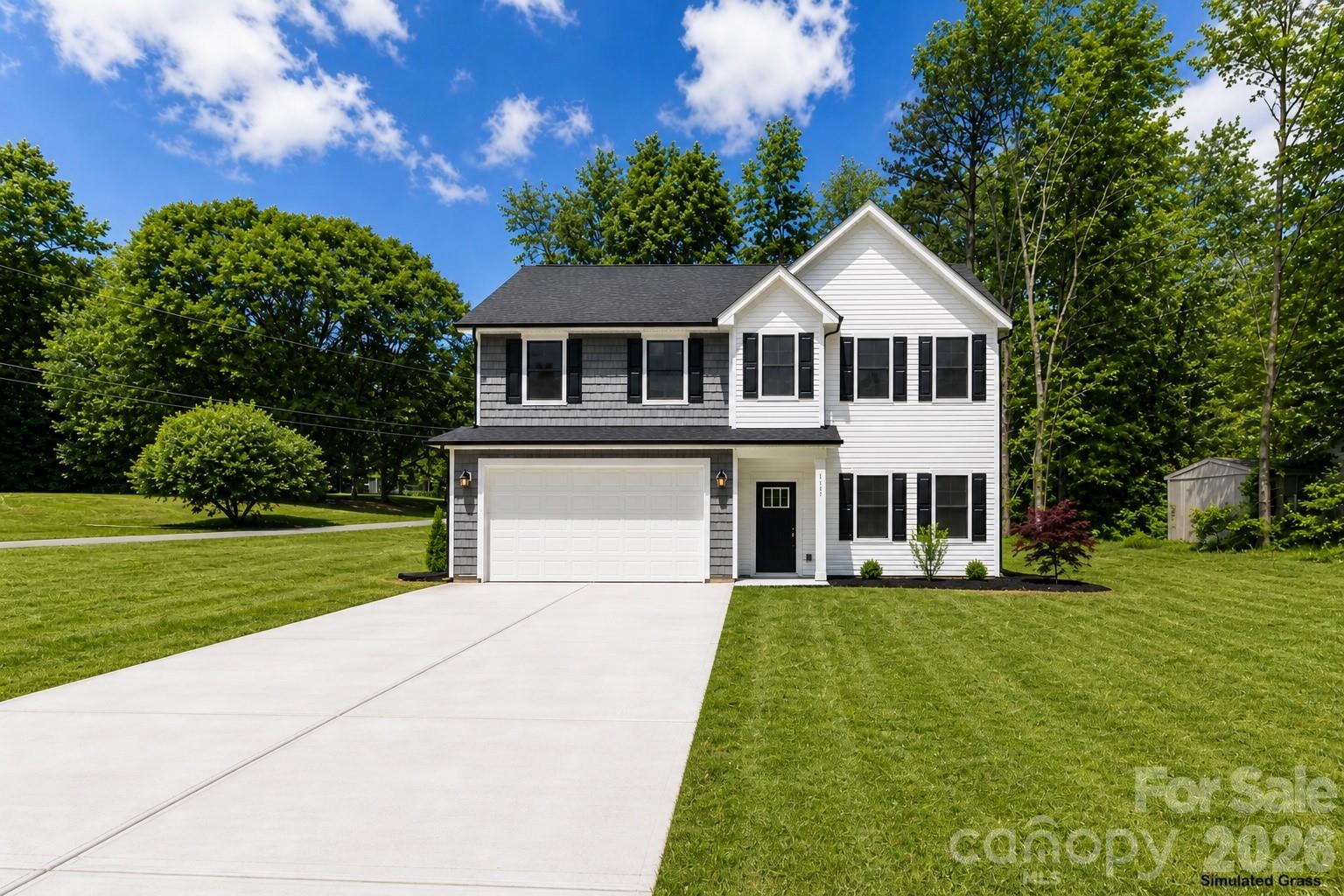 Cozy yet spacious new construction home featuring modern finishes in a peaceful Northeast Hickory neighborhood with less traffic and a relaxed setting. This thoughtfully designed 4-bedroom, 2.5-bath home offers an open-concept layout filled with natural light, a stylish kitchen with stainless steel appliances, sleek countertops, ample cabinetry, and a large island perfect for entertaining. The spacious primary suite features a walk-in closet and a beautifully tiled walk-in shower with a double vanity, creating the perfect retreat. Conveniently located near Tabernacle Christian School, Hickory Christian Academy, Hickory City Schools, the Hickory Riverwalk, parks, shopping, dining, and downtown Hickory. The yard has been reseeded and treated to promote lush, healthy grass. Move-in ready with virtual staging and simulated grass used in some photos.