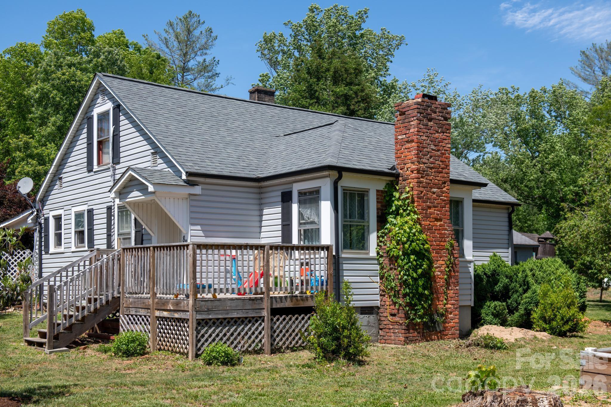 Charming and full of character, this 3-bedroom, 1.5-bath home in Morganton offers the perfect blend of comfort, convenience, and affordability. Listed below recently appraised value. Appraisal is provided in the listing attachments. This home won't last long. Situated on approximately 0.67 acres, this property offers ample outdoor space while remaining conveniently located near I-40, shopping, dining, and parks. Featuring over 1,400 square feet of living space, the home offers a functional layout with primary living areas on the main level and an additional upper-level bedroom with a half bath. Inside, you’ll find beautiful hardwood floors and added mini-split systems (2025) for enhanced comfort and efficiency. Outside, enjoy a fenced backyard with a variety of fruit trees, grapevines, thornless blackberry bushes, and raspberry plants, adding charm and functionality to the property. With easy interstate access and plenty of room to enjoy both inside and out, this home offers a wonderful opportunity for a primary residence, first home, or investment property.
