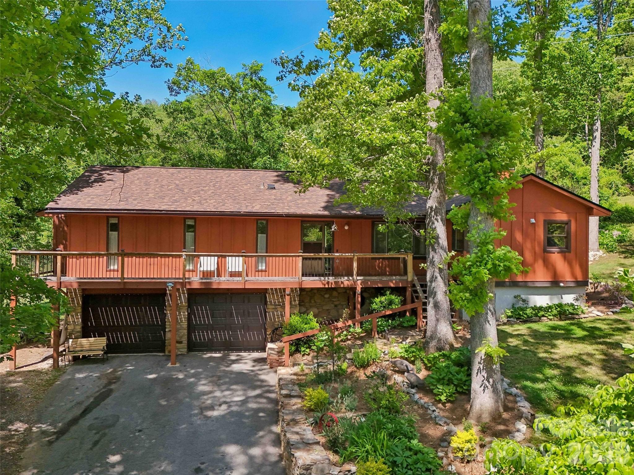 Welcome to your Blue Ridge foothills sanctuary nestled in the St Andrews subdivision of Arden. This sweet home offers the perfect blend of modern upgrades and serene outdoor living. The updated kitchen designed for style and efficiency, has stainless steel appliance, granite counters and stack washer/dryer for convenience. Enjoy a morning coffee with long range winter views from the front wrap around deck or hot tub on the expansive rear deck for unwinding under the stars. With 3 bedrooms/3 baths, family room, living room and den you’ll have plenty of room to live and grow and not worry about the big stuff, with a new roof in 2025, newer HVAC and gas water heater. Stone fireplace in the family room and wood stove in the basement area for cool winter nights. Oversized two car garage allows ample room for a workshop.