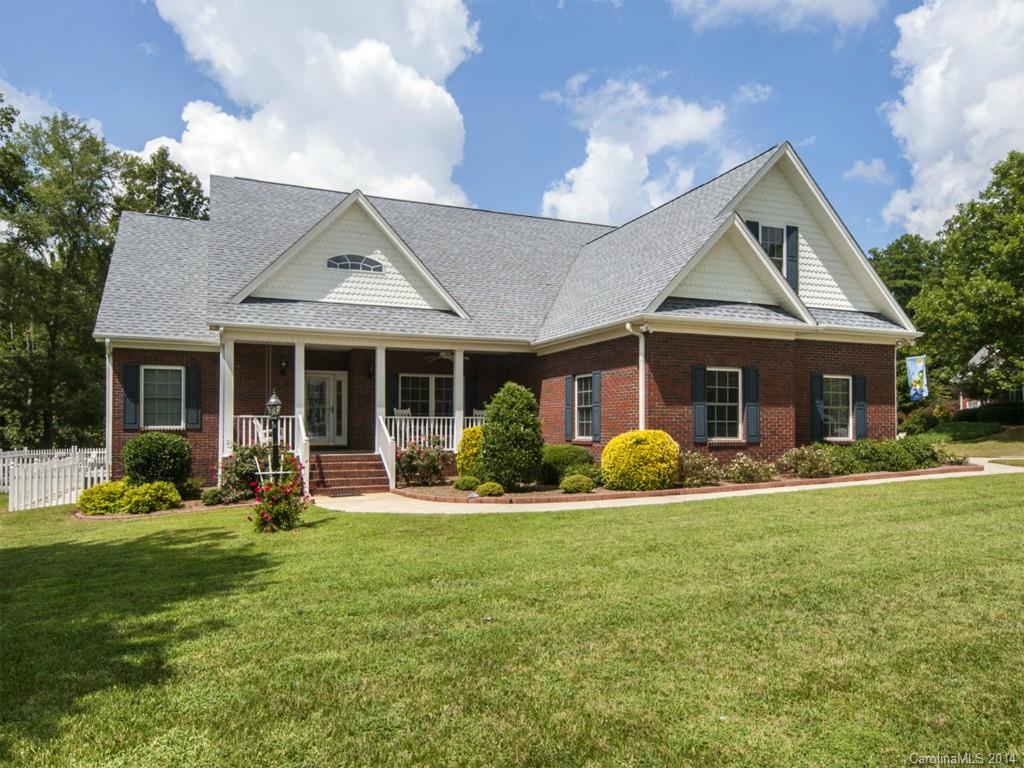 Beautiful custom built home with in-ground swimming pool, rocking chair front porch and screened in back porch.  Tall, vaulted ceiling in the open concept great room.  Split bedroom floor plan.  The master suite boasts tray ceilings and beautiful five-piece master bath. Second floor extra-large storage space could easily be sheetrocked for another bedroom/bonus room and bathroom.  20x24 Exterior workshop has a garage door and could fit a third car.  Unique corner lot/cul-de-sac location.