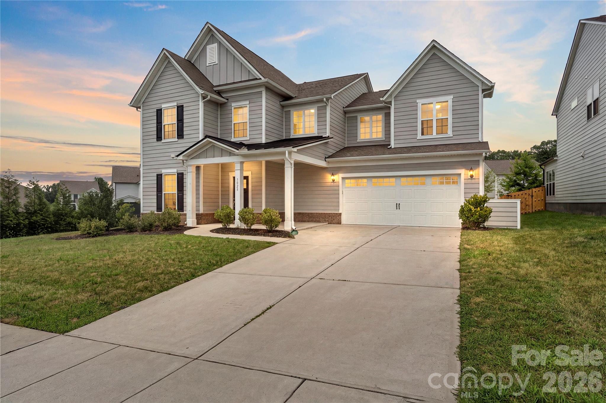 Magnificent 2-story home offering 5 bedrooms, 3.5 bathrooms, and over 3,600 square feet of thoughtfully designed living space on the South Carolina side of the desirable McCullough Neighborhood! The main level open-concept floor plan features beautiful wood flooring throughout the main living areas, a spacious living room with a stone surround gas fireplace flows into breakfast area, and the gourmet kitchen - equipped with a large center island with seating, butler’s pantry, wine refrigerator, gas cooktop, quartz countertops and abundant cabinetry, makes it perfect for everyday living or entertaining. A main-level bedroom provides excellent flexibility for guests or an additional home office. The main level is completed with a dedicated sunroom, planning/drop station and a formal dining room. Upstairs, enjoy the luxurious primary suite featuring tray ceilings, dual vanities, tile surround shower with bench and an oversized walk in closet. Three additional bedrooms provide additional living space or flex space as needed. The spacious loft/second living area makes for a perfect play area, entertainment room or hobby space! Outside, relax on the huge covered patio beneath the custom pergola with the ability to open and close making it perfect for any weather. Located in an amenity-rich community with a clubhouse, outdoor pools, dog park, tennis courts, playgrounds, ponds, and walking trails plus just minutes from Downtown Pineville, Fort Mill and easy access to I77 and 485 loop