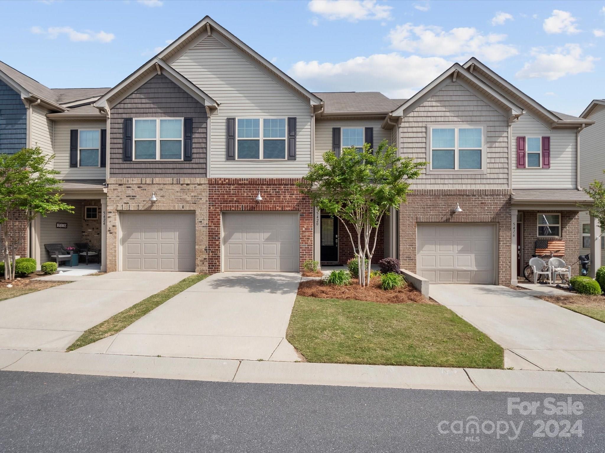 This exquisite 3-bedroom, 2.5-bathroom residence offers a perfect blend of modern elegance and comfortable living.As you step inside, you'll be greeted by the inviting ambiance of vinyl plank flooring throughout the downstairs area, creating a seamless flow from room to room. The spacious open floor plan seamlessly connects the living room, where a cozy gas fireplace awaits to warm your evenings, to the stylish kitchen, making entertaining a breeze.The kitchen is a chef's delight, boasting a large granite island that doubles as a breakfast bar, complete with a gas range and stainless steel appliances.Step outside from the living room onto the screened-in porch, where you can enjoying the fresh air and serene surroundings. This townhome is situated in a highly desirable subdivision that offers the convenience of walking distance to shopping, restaurants, and other amenities, ensuring that everything you need is right at your fingertips.
