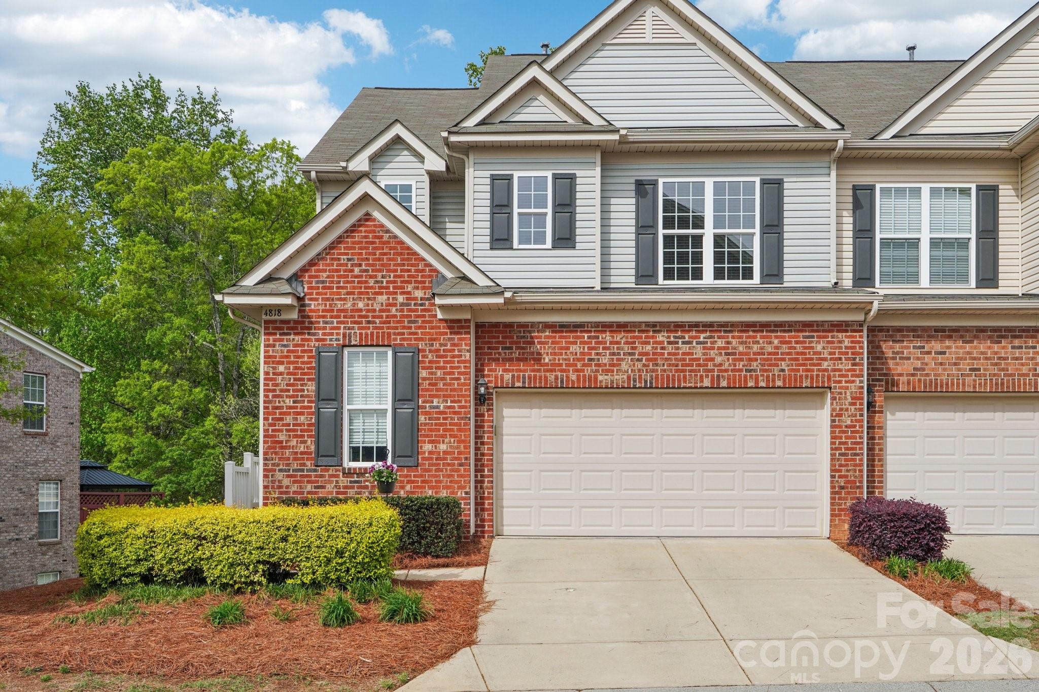 Welcome to this beautifully maintained end-unit townhome in the highly sought-after gated community of Park South Station, offering the perfect blend of style, flexibility, and location. With 3 bedrooms, 3.5 bathrooms, a walk-out basement, and a 2-car garage, this thoughtfully designed home features spacious living areas, beautiful upgrades, and rare outdoor privacy with both a huge elevated deck and a tree-lined backyard.
Filled with natural light, the open-concept main level is designed for effortless everyday living and entertaining. Updated flooring, elegant finishes, crown molding, designer accent walls, and a cozy fireplace create a warm and inviting atmosphere, while a dedicated office provides the ideal work-from-home setup.
The kitchen is truly the heart of the home, featuring stunning quartz countertops, an oversized island with seating, 42-inch cabinetry, a 5-burner gas range, breakfast bar, and an expansive custom pantry with built-in shelving designed for exceptional organization and storage.
Step outside to the oversized deck overlooking mature trees — a peaceful extension of the home perfect for morning coffee, outdoor dining, or relaxing evenings surrounded by privacy.
Upstairs, the spacious primary suite offers a true retreat with a spa-inspired bathroom and a large walk-in closet complete with custom organization systems. The upper level also includes an additional bedroom, full bathroom, convenient laundry area, and a versatile loft space easily suited for a media room, playroom, second office, or potential fourth bedroom.
The walk-out lower level adds incredible flexibility with a third bedroom, full bathroom, bonus living area, and a dedicated workshop space ideal for hobbies, fitness, storage, or additional entertaining. The lower patio and private backyard create yet another inviting outdoor living area rarely found in townhome living.
Additional highlights include a new roof (2026), finished garage flooring, built-in garage storage, upgraded trim details, and exceptional natural light throughout.
Residents of Park South Station enjoy resort-style amenities including a pool, clubhouse, dog park, playground, and sidewalks, all conveniently located just minutes from SouthPark, Park Road Shopping Center, the light rail, major highways, dining, shopping, and Charlotte Douglas International Airport.
This home truly offers the perfect combination of luxury, functionality, and low-maintenance living in one of Charlotte’s most desirable gated communities.