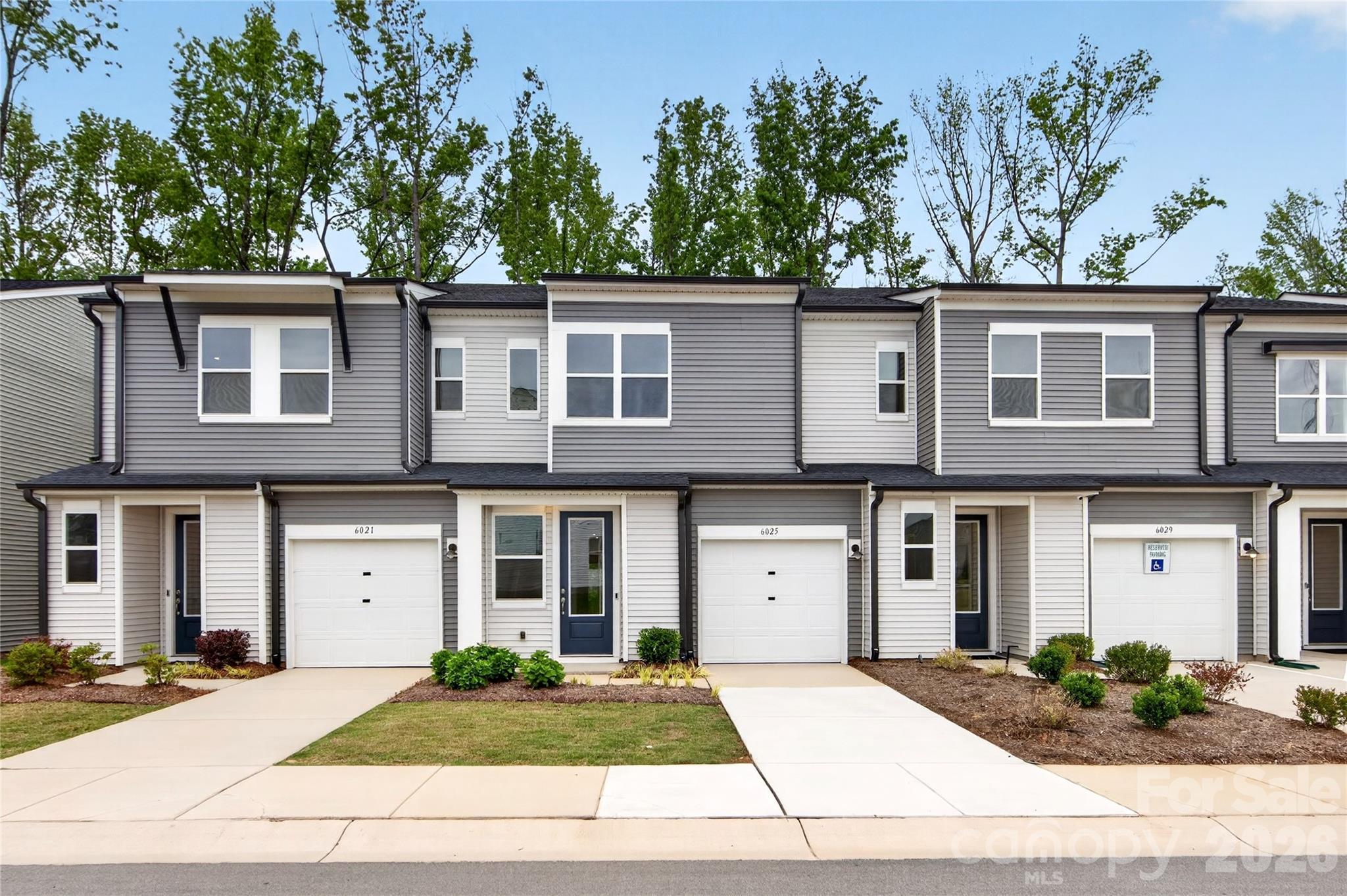 Welcome home to 6033 Longar Lane, an Anson plan in Fifteen 15 Cannon. This home comes complete with appliances and furniture included, so you can move right in and start living. Inside, you'll find open concept living on the first floor, with the chef-inspired kitchen anchoring the back of the home and featuring white cabinets, white quartz countertops, and a large walk-in pantry. Step right out from the kitchen to your outdoor living space with tree-lined views, or head across to the open community green space just steps from your door. Upstairs, a spacious loft gives you extra room to spread out, alongside the primary suite and a secondary bedroom with its own bathroom. The primary bathroom features a tiled walk-in shower. With 2 bedrooms and 2.5 bathrooms across 1,493 square feet, plus a 1 bay garage, this home has everything you need. Enjoy sunlight-filled, low-maintenance living in a community with cared-for landscaping, tree-lined paths perfect for strolling with your dog, and Charlotte's energy, from dining to arts to entertainment, just moments away.