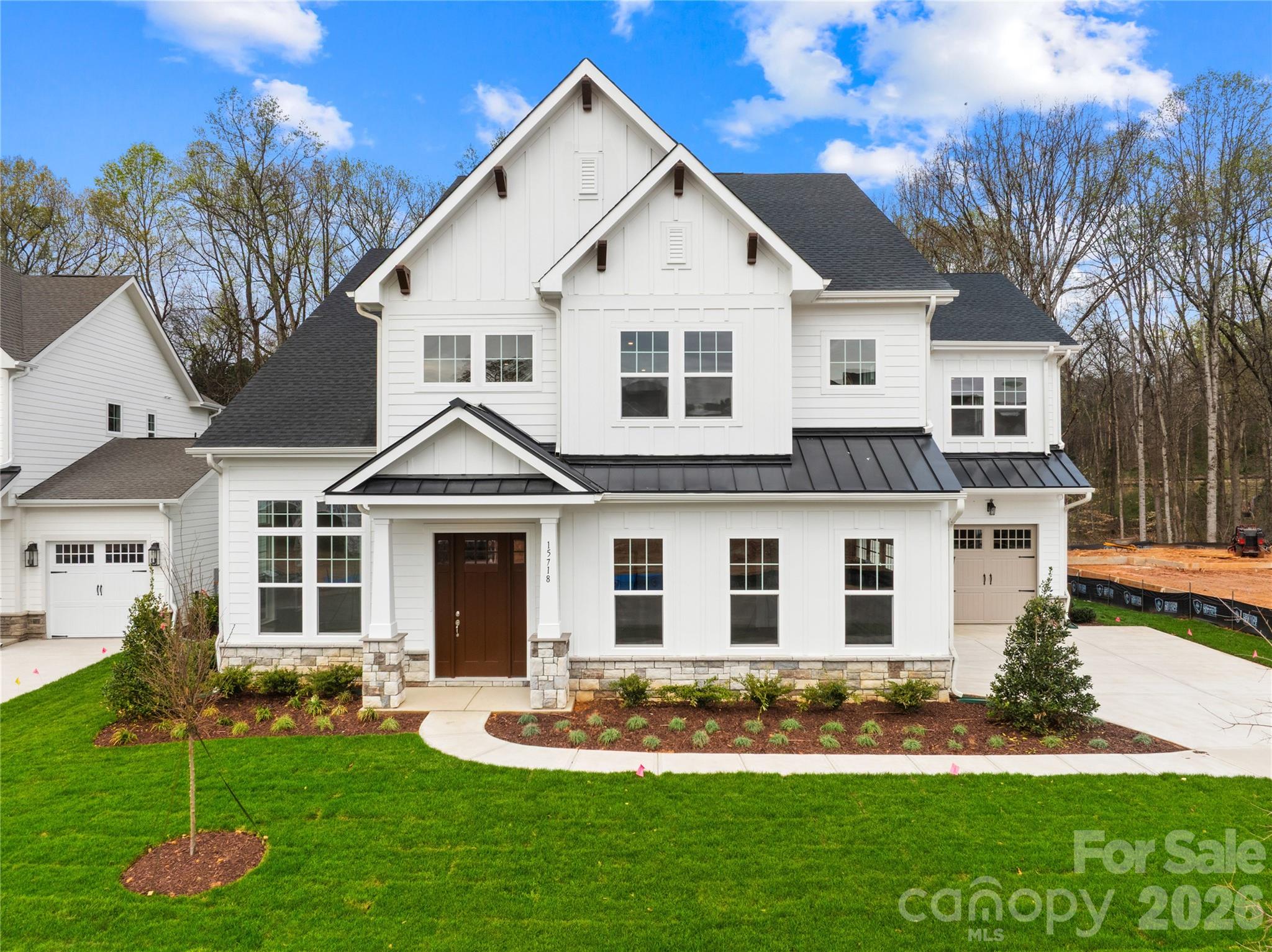 Better than new and never occupied, this exceptional luxury residence in sought-after Coventry Glen offers nearly 5,000 square feet of thoughtfully designed living space with high-end designer finishes throughout. Featuring 5 bedrooms and 5.5 baths, this home seamlessly blends elegance, comfort, and modern functionality in one of the most desirable locations near Davidson. Step inside to find 8-foot interior doors, a stunning private office with soaring 12-foot ceilings and transom windows, and an open-concept layout designed for both everyday living and entertaining. The gourmet chef’s kitchen showcases upgraded quartz countertops, custom oak detailing, a professional-grade range hood, premium appliances, and an expanded breakfast area highlighted by a beautiful bay window and sunroom filled with natural light.

The spacious great room features a cozy gas fireplace and dramatic 12-foot stackable sliding glass doors that create effortless indoor-outdoor living. Enjoy entertaining year-round on the covered patio and screened porch overlooking one of the community’s largest and most private backyards, complete with a wooded buffer and ample space for a future pool. The main level also includes a private guest suite with a full ensuite bath, along with a separate powder room for visitors. Upstairs, retreat to the luxurious vaulted primary suite featuring peaceful wooded views, a spa-inspired bath with soaking tub and oversized tiled shower, and separate his-and-her walk-in wardrobes. Three additional secondary bedrooms each offer private ensuite baths and walk-in closets, while the large pre-wired media room provides the perfect flex space for movie nights, gaming, or a home theater. Additional upgrades include a rare 3-car split garage, solid oak open-rail staircase, tile-surround showers throughout, and pre-wired security system.

Located less than 3 miles from Historic Downtown Davidson and just minutes from Birkdale Village, Lake Norman, shopping, dining, and I-77, this move-in ready luxury home also benefits from highly sought-after assigned schools recognized among the top-ranked schools in the area, making this an exceptional opportunity for buyers seeking both luxury living and strong educational options.

This home offers the perfect blend of privacy, convenience, upscale finishes, and premier location.