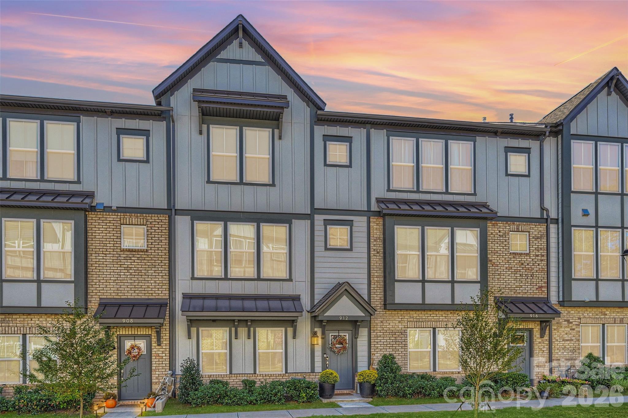 Rare 4-Bedroom Opportunity with a Fresh New Price! In a market where three-bedroom units are the norm, this stunning three-story townhome stands out by offering four spacious bedrooms and 3.5 bathrooms, now available at an incredible, newly adjusted price point. The thoughtful layout begins on the main entry level, which features a private bedroom with a full bath—perfect for guests or a home office—alongside a two-car garage with epoxy flooring. Upstairs, the main living level is an entertainer’s dream, boasting an expansive living room, an additional serving area, a massive walk-in pantry, and a gourmet kitchen equipped with quartz countertops, a large island with barstool seating, a gas cooktop with a stainless steel exhaust vent, and a timeless tile backsplash.

The third floor serves as a private retreat, featuring two additional bedrooms with a shared bath, a convenient tankless water heater, and a luxurious primary suite complete with a tray ceiling, a walk-in closet, a dual vanity, and an extended shower with a bench seat and custom niche. Offering an abundance of closet space throughout and an unbeatable walkable lifestyle, you can leave your car at home and stroll to nearby restaurants, shops, the grocery store, and the popular Davidson concert series. Don't miss this exceptional value!