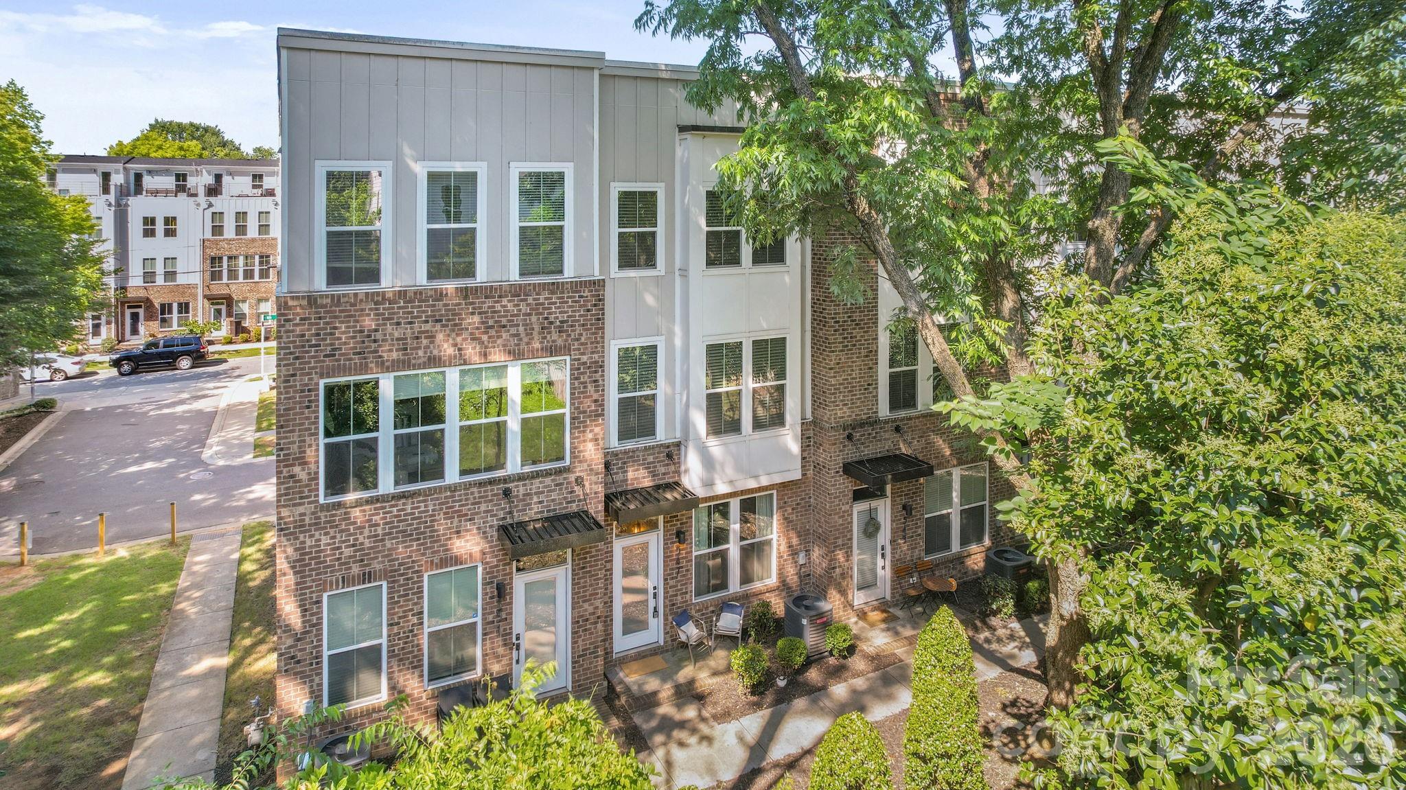 Struggling to find the perfect center-city neighborhood? Your search ends here in Optimist Park. This move-in ready townhome is ideally positioned between Uptown, NoDa, and Plaza Midwood, with the 16th Street light rail station just a few blocks away. With a spacious open-concept main floor and two private bedroom suites on the upper level, each featuring their own full bathroom, this is the perfect place to call home. A private two-car garage ensures you never have to worry about parking. Optimist Hall is evolving rapidly and now is the time to stake your claim! This property has a deed restriction to keep pricing accessible. Prospective buyers must make less than 120% of the area median income, approximately $98K for single income households.