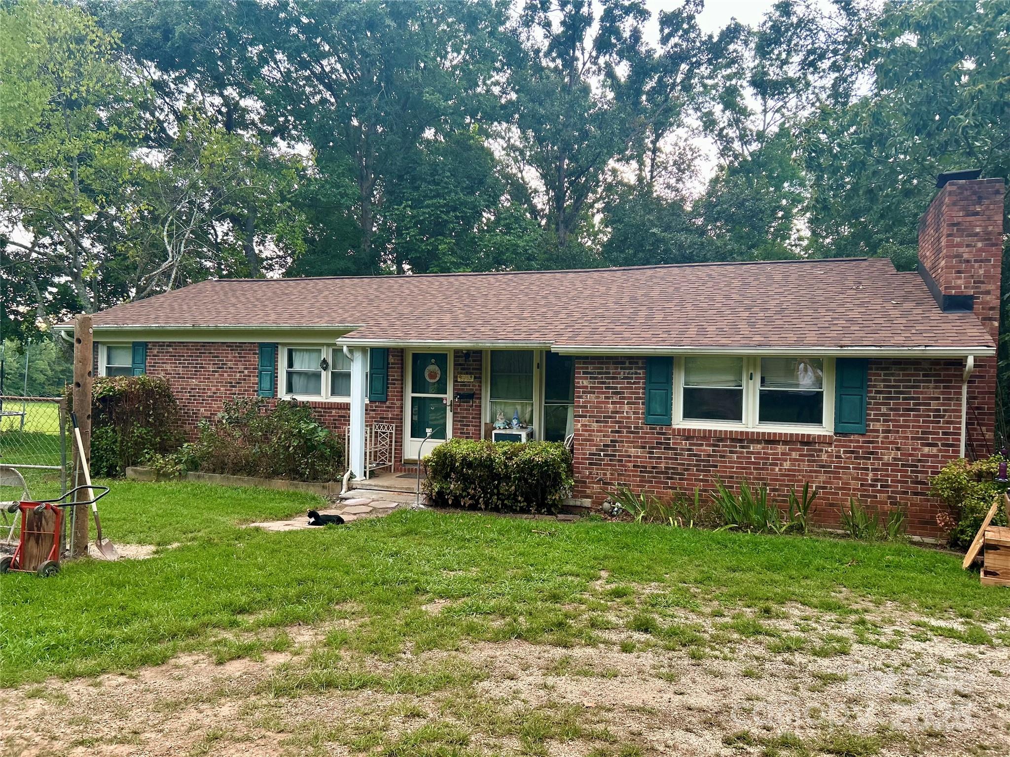 SHOWINGS ARE OPEN AGAIN AND SELLERS ARE WORKING ON MOVING OUT! This 2-bedroom, 2-bath home sits on 2.54 acres in Hickory Grove and offers a fantastic opportunity for a full remodel or flip. While the property is in need of updates, several major improvements have already been completed, including a brand-new well installed within the last 6 months, a new water heater within the last 4 months, and a new roof within the last 6–7 months per the sellers. Inside, the home features a wood-burning fireplace that is used every winter, a canning room off the laundry area, and a flex space currently being used as the dining area but also ideal as a den or sitting area. The property also includes five separate outbuildings—all with power connected. The septic system was pumped in 2019 and a new leach field was installed at the same time. With its recent upgrades, multiple outbuildings, and acreage, this property has strong potential for anyone looking for a full renovation project.