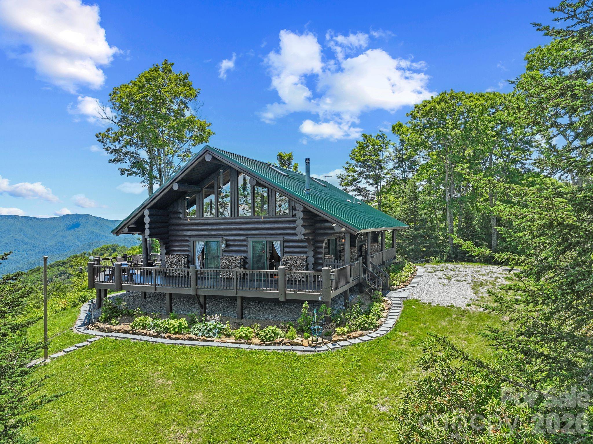 Miles of views from this unicorn property. Nestled amidst the majestic peaks of the Pisgah National Forest, this 2 bedroom, 2.5 bath off-grid sanctuary spans 13.52 acres of rolling woodland and open vistas, offering unparalleled privacy and serenity.  Totally renovated, furnished and powered by sustainable solar energy, with a back up genertor and two 1,000 gallon propane tanks, the thoughtfully designed and renovated cabin blends modern comforts with rustic elegance.  Featuring spacious living areas bathed in natural light, a totally renovated kitchen with upgraded appliances is ideal for preparing harvests from your own land.  Expansive decks for unwinding after a day of exploration offer sweeping mountain panaramas.  Whether you're seeking a self-suffient homestead, a serene family retreat/compound, or an exclusive mountain escape this rare property invites you to embrace the freedom of off-grid living while immersed in the timeless beauty of one of America's most iconic landscapes. 
The property offers 2 entrances either from Highway 19 in Burnsville or from the end of Barnardsville Road and is within a private gated community called Ogle Meadows.  Additionally, the property's additional buildable flat acreage make it an excellent choice for a family compound or a future investment opportunity. 
Please see Features Sheet for more details and information on upgrades/renovations done.
Call Listing Agent for questions: Charisse Dunn 828-551-2895