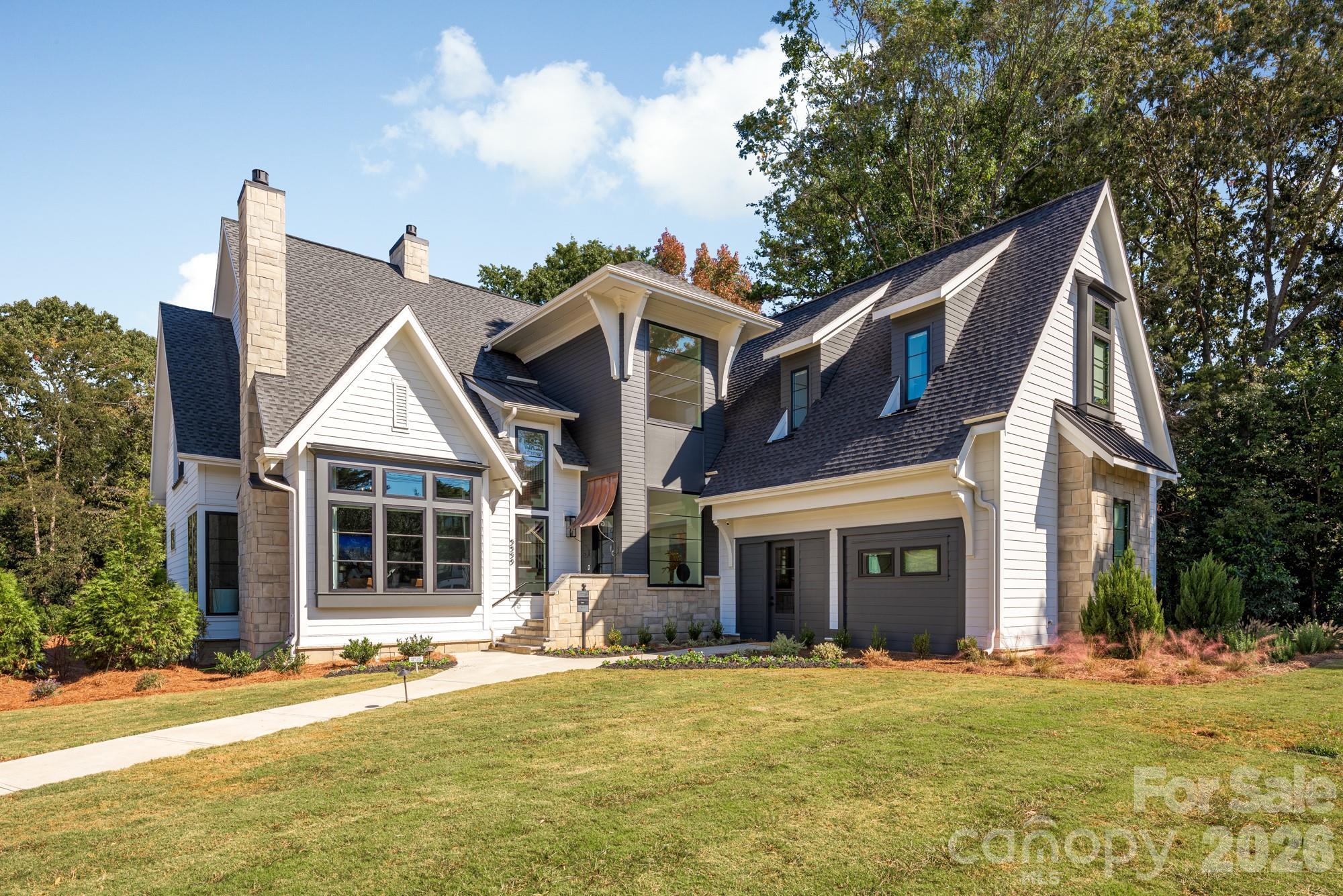 Built by Copper Builders, three-time Builder of the Year, this professionally designed SouthPark model home is now available for purchase. Showcasing the craftsmanship, design, and attention to detail that define the award-winning builder, this exceptional residence delivers everything you've been looking for in one of Charlotte's most desirable neighborhoods. Positioned on one of SouthPark's most prominent corners, the home seamlessly blends everyday comfort with sophisticated spaces for entertaining. The main level is anchored by a private primary suite, where oversized windows overlook the pool and fill the space with natural light. A glass-enclosed wine room serves as a striking focal point, while the chef's kitchen features Thermador panel-ready column refrigeration, a walk-in pantry, and abundant custom storage. A dedicated office with soaring vaulted ceilings provides an inspiring work-from-home retreat. Upstairs, three secondary bedrooms include two private ensuite baths, while a sunken media and recreation room creates the perfect setting for movie nights, game days, or gathering with family and friends. The finished lower level offers outstanding flexibility with expansive recreation space and a full bath already in place - ideal for entertaining or future customization. This is a rare opportunity to own a professionally designed model home in one of Charlotte's most desirable neighborhoods, combining luxury, functionality, and timeless design in the heart of SouthPark. Following closing, Copper Builders will lease the home back through December 2026 with an optional 90-day extension, offering the new owner a seamless and flexible transition into the home.