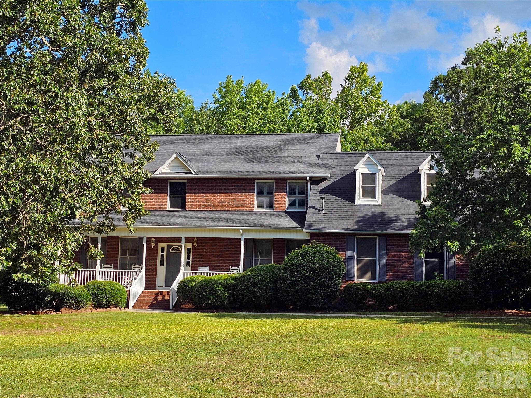 COMMUTER’S DREAM!  This custom-built (±2899 HSF) two-story brick home, centered on ±1.23 level acres with a deep wooded backyard buffer, provides numerous high-end upgrades plus an abundance of living space for privacy, comfort and convenience in quiet Victorian Hills (32 homes) located less than 1 mile from I-77 (Exit 65) in rural Richburg, SC.  Three spacious bedrooms (primary with two customized walk-in closets) -- 2.5 beautifully-upgraded bathrooms (primary looks and feels like a spa) -- large (±325 HSF) finished bonus room ideal for home office, recreation and/or guests -- sunroom with real hardwood floors and backyard deck access (ideal hobby, reading, office or fitness room) -- formal dining room with real hardwood floors, built-in shelving and backyard deck access – super kitchen (neutral painting scheduled) with tile floor, quartz countertops, large (and removeable) peninsula  bar, additional dining area, updated stainless steel appliances (natural gas range, dual ovens, microwave, dishwasher, refrigerator), pantry  and gleaming cherry cabinets.  Custom built-in plantation shutters throughout.  Fiber optics internet, dual natural-gas HVAC; new carpet throughout upper level.  Oversized (±607 SF) two-car garage with a wall of custom built-in storage shelving, utility sink and backyard access.  Rocking chair front porch (rocking chairs included).  Tranquil backyard with deck (feed the birds, watch the deer, love the difference). Concrete driveway with brick mailbox, lighted driveway and front sidewalk brick pillars.  LEWISVILLE SCHOOLS.  A home is an INVESTMENT – choose the custom QUALITY option.  Virtual staging photos provided.  House is vacant and MOVE-IN READY!