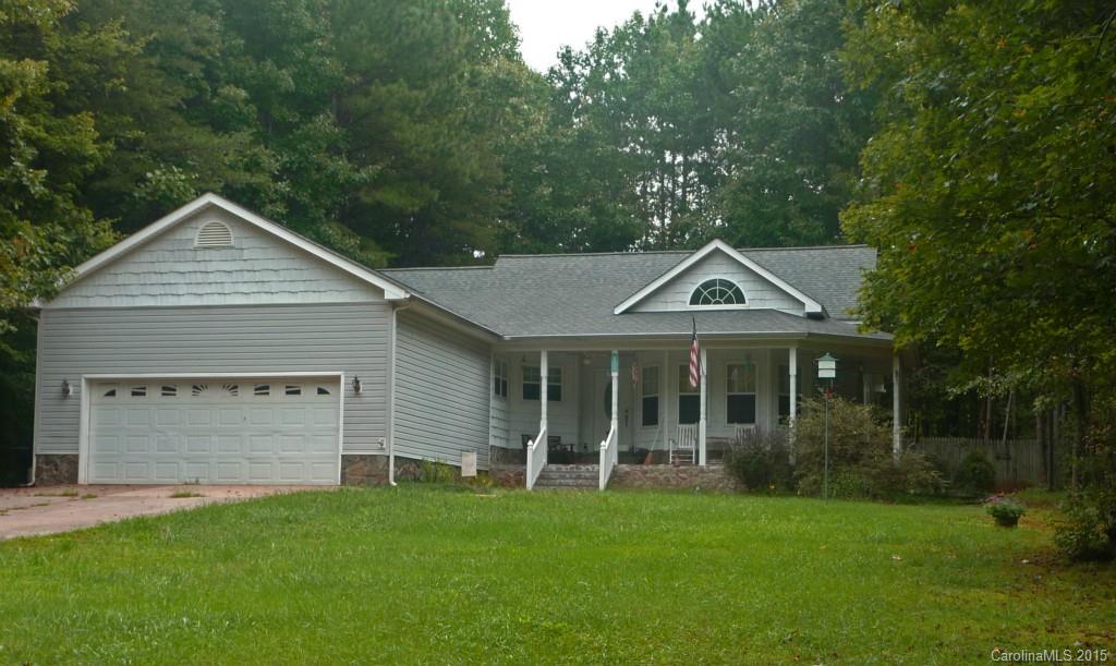 The Retreat is a small quiet lakefront community w/lake access and boat slips.Located on a large wooded lot. You are welcomed home by a spacious wrap around porch.Home features an open floor plan w/ cathedral ceiling and a split floor plan. Large garage with a wall of cabinets and shelving. Fenced back yard. Low HOA 240, additional 257 for boat slip. Boat slips are by annual lottery, to date boat slips have been available to all that wanted on.. Great schools, low taxes, Home Warranty.