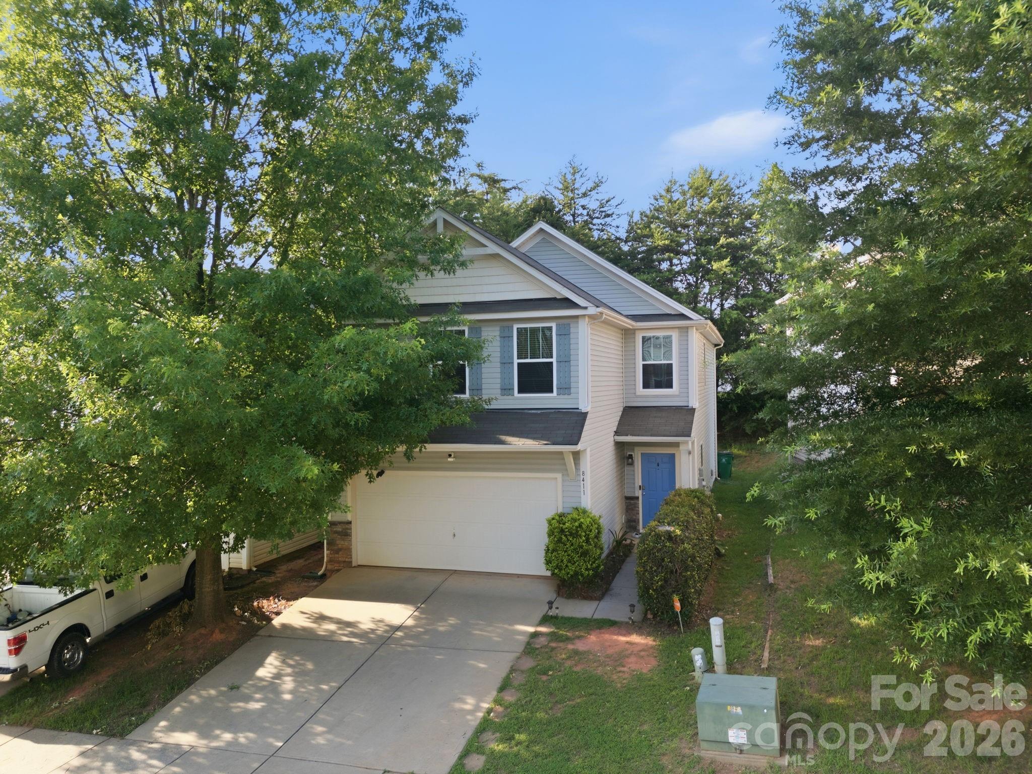 Welcome to 8411 Washoe Pine Lane in Charlotte, a well-maintained home backing trees with thoughtful updates, flexible living space, and community amenities. Freshly painted last year, this home features granite countertops, stainless steel appliances, a pantry, and a functional layout designed for everyday living. The main level includes an entrance hallway and a versatile fourth room that could serve as a bedroom, private office, or playroom. Upstairs, the primary suite offers new lighting, a new ceiling fan, double vanity, garden tub, and walk-in closet. One of the larger secondary bedrooms has also been upgraded with added shelving. Major systems include a 2022 furnace, 2022 condenser, and 2013 water heater, and the home is wired for a security system. Enjoy access to the community pool and a convenient Charlotte location, making this a great opportunity for buyers looking for comfort, flexibility, and value.
