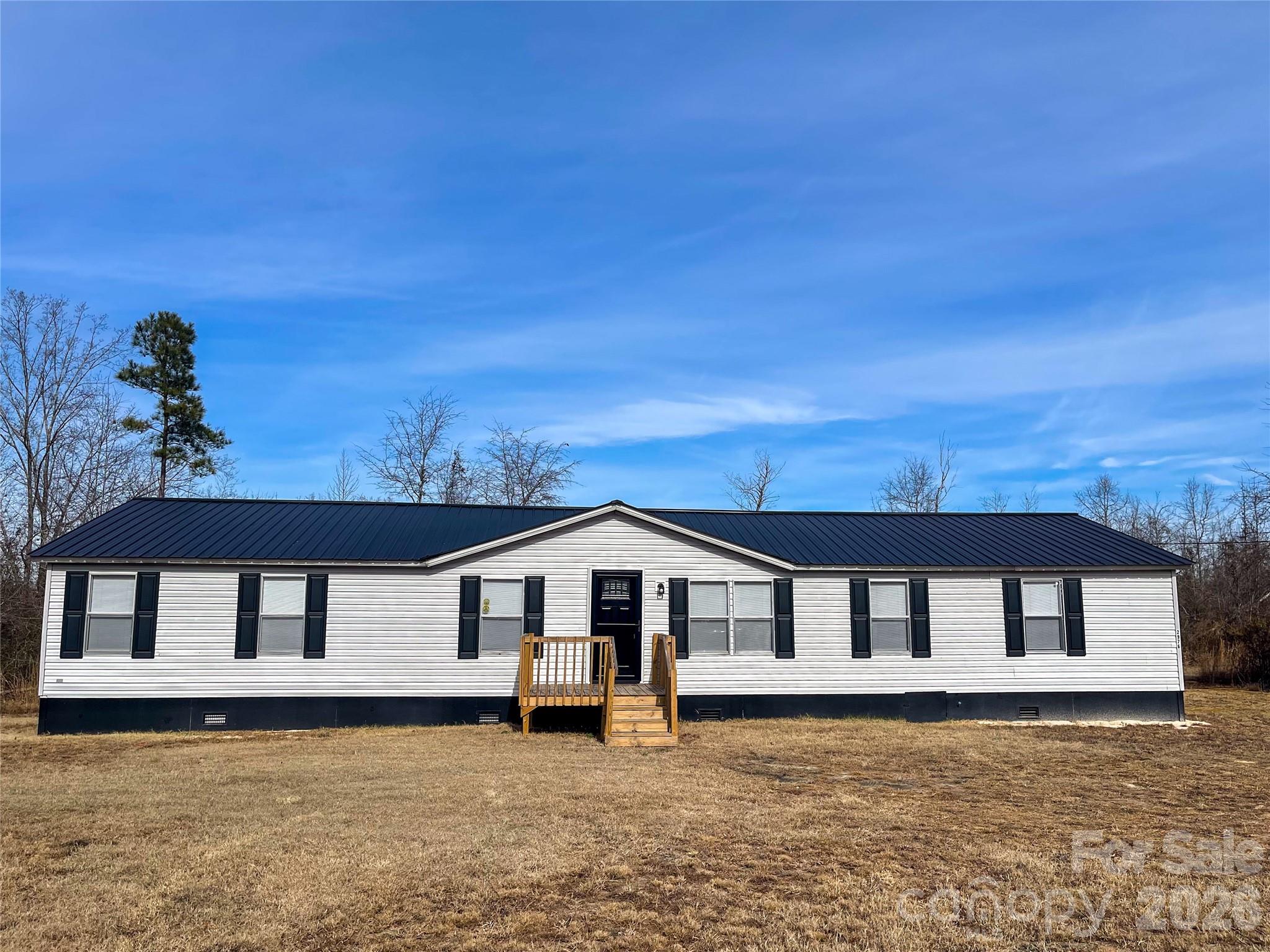 SELLER MOTIVATED TO SELL!
2976 Stephens Rd, Bethune, SC 29009
4 Bedrooms | 2 Bathrooms | 1,904 Sq Ft | 2.58 

Welcome to peaceful country living on 2.58 acres in Bethune! This beautifully remodeled 4-bedroom, 2-bath doublewide home offers 1,904 sq ft of living space with a bright, open floor plan designed for modern comfort.

Step inside to a spacious living room with updated flooring and neutral paint throughout. The kitchen has been fully refreshed with stylish cabinetry, beautiful butcher block countertops, and newer appliances, opening into a dining area perfect for family meals.

The primary suite features a large walk-in closet and a private bathroom with dual vanities, soaking tub, and separate shower. Three additional bedrooms and a second full bath provide plenty of space for family and guests.
Outside, enjoy the quiet country setting with room for a garden, animals, or simply relaxing under the Carolina sky. With nearly 3 acres, this property offers the space and privacy you’ve been searching for.
MH Title has been retired.

Conveniently located in rural Bethune and a short drive to Camden, Hartsville, and surrounding communities. This move-in ready home combines modern updates with rural charm—don’t miss your chance to make it yours!