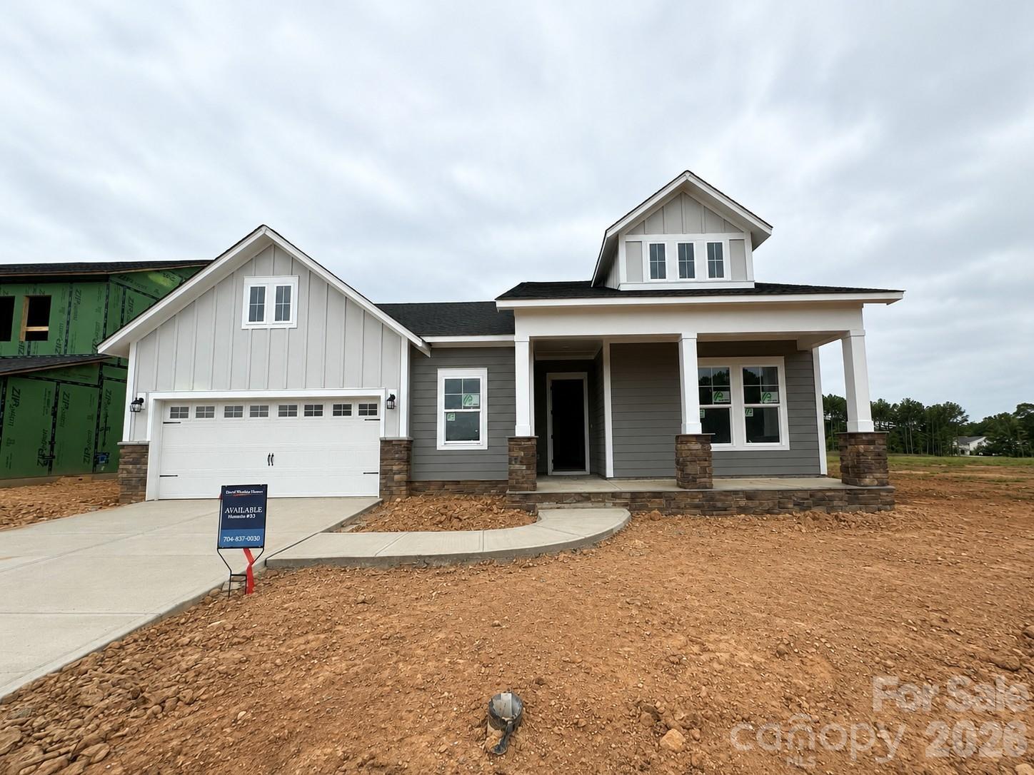 Welcome home to this beautiful one-story home! Soaring 10-foot ceilings and abundant natural light create an airy, expansive interior in this quick-move-in Ingrid Ranch. The open kitchen — centered on a big island with a walk-in pantry connects to the family and dining areas with clean sight lines and effortless indoor–outdoor access to the extended covered patio. A study provides a private nook for work, while the 2.5 car garage entry’s drop zone and utility with counter keep everyday traffic neat and efficient.

The Owner’s Retreat spans the back for maximum privacy, with a spa-inspired bathroom and a large walk-in closet. Two additional bedrooms and baths offer comfortable space for family or guests. Light wood-look flooring and a coordinated palette of cabinetry and quartz counters complete a calm, modern interior designed to celebrate natural light.

Hardy Pond is a walkable neighborhood with easy access to grocery, local restaurants and nearby parks. Homes at Hardy Pond emphasize luxury, quality and service — featuring custom-look, high-end finishes, 10' ceilings, 2x6 exterior wall construction and energy-efficient systems.

Every new home includes a 10-year new-home warranty, and the personalized service David Weekley Homes is known for, with a focus on craftsmanship, thoughtful design and long-term support.

Contact the David Weekley at Hardy Pond Team to schedule your tour in Rock Hill, SC.