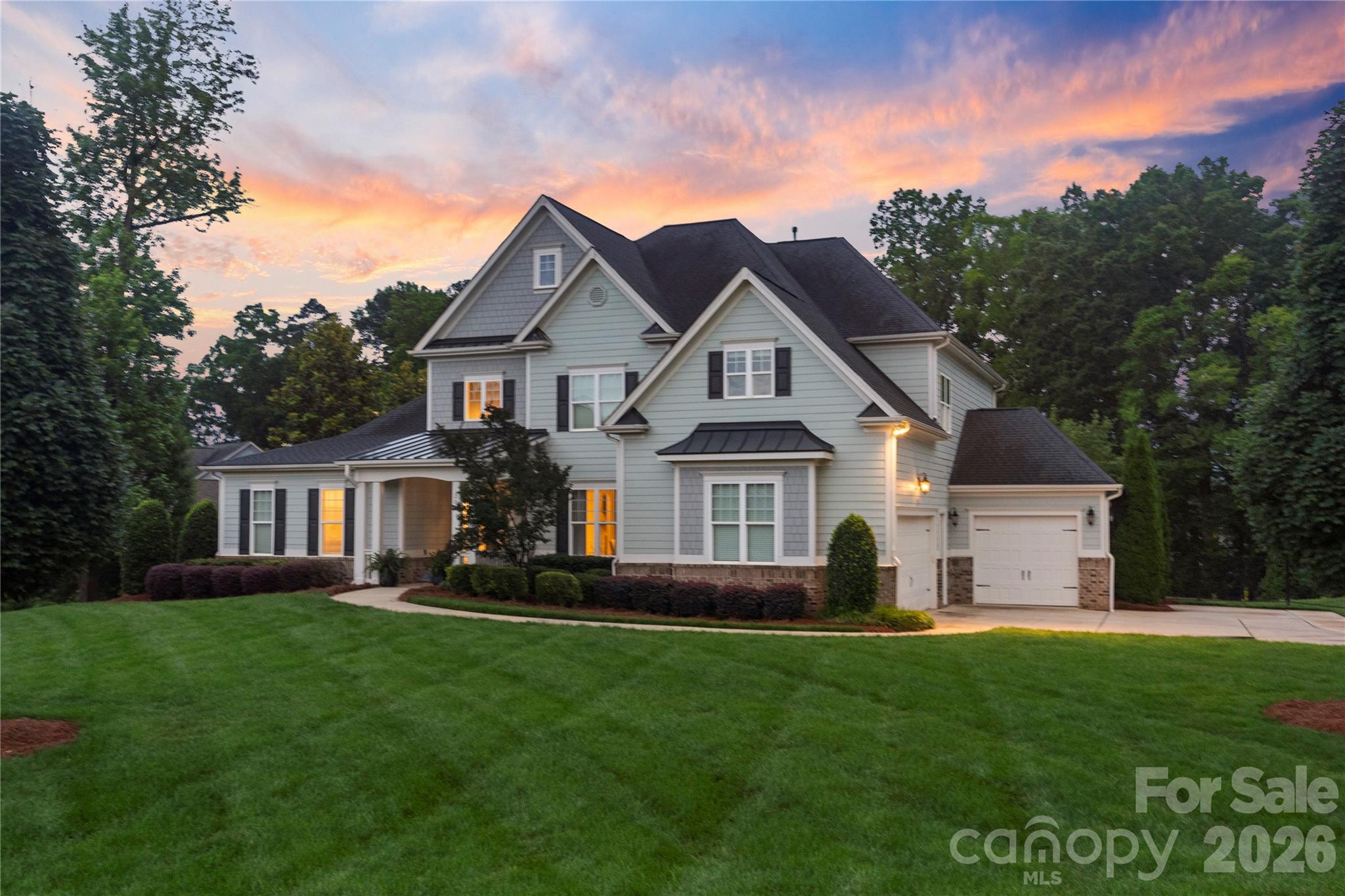 Perfectly positioned in Belmont near Lake Wylie, this exceptional 5-bedroom, 4.5-bath residence offers luxury living with designer finishes and premium appliances throughout. Expansive windows fill the open-concept main level with natural light, while a gas fireplace creates a warm and inviting focal point. The chef’s kitchen features an oversized island, custom pantry shelving, and seamless flow for everyday living and entertaining. A large pantry with custom shelving and a built-in drop zone in the spacious laundry room add thoughtful functionality.
Notable upgrades include smart home lighting with dimmers in main living areas, smart locks, an enhanced irrigation system, plantation shutters in the primary bedroom, custom electric window treatments, a whole-house water filtration system, and a coveted three-car garage. Step outside from the screened porch to a beautiful backyard retreat, ideal for indoor-outdoor entertaining and year-round enjoyment. A rare opportunity to own a meticulously maintained home in one of Belmont’s most desirable communities, just minutes from the recreation and lifestyle of Lake Wylie.