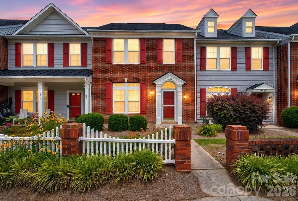 Nestled in the heart of Lake Park, this charming brick-front townhome offers the perfect blend of comfort, convenience, and low-maintenance living. Freshly painted interiors, fresh neutral finishes, luxury vinyl plank flooring, and abundant natural light create a bright and welcoming atmosphere throughout the main level. The well-appointed kitchen features abundant cabinetry, updated appliances, a breakfast bar, and generous prep space, flowing seamlessly into the dining area and spacious living room. A cozy gas-log fireplace serves as the focal point of the living space, creating the perfect setting for relaxing evenings or entertaining guests. Upstairs, two generously sized bedrooms each enjoy access to a full bath, including a spacious primary suite complete with a walk-in closet and a relaxing garden tub. Outside, a private fenced courtyard-style patio provides an ideal retreat for outdoor dining, entertaining, or simply unwinding, with the added convenience of a storage closet. Residents enjoy an exceptional array of community amenities, including a pool, clubhouse, pickleball and tennis courts, walking trails, playgrounds, a dog park, scenic ponds, and recreation areas. Ideally located near shopping, dining, and major commuter routes, this move-in-ready home offers an outstanding lifestyle in one of Lake Park’s most desirable communities.