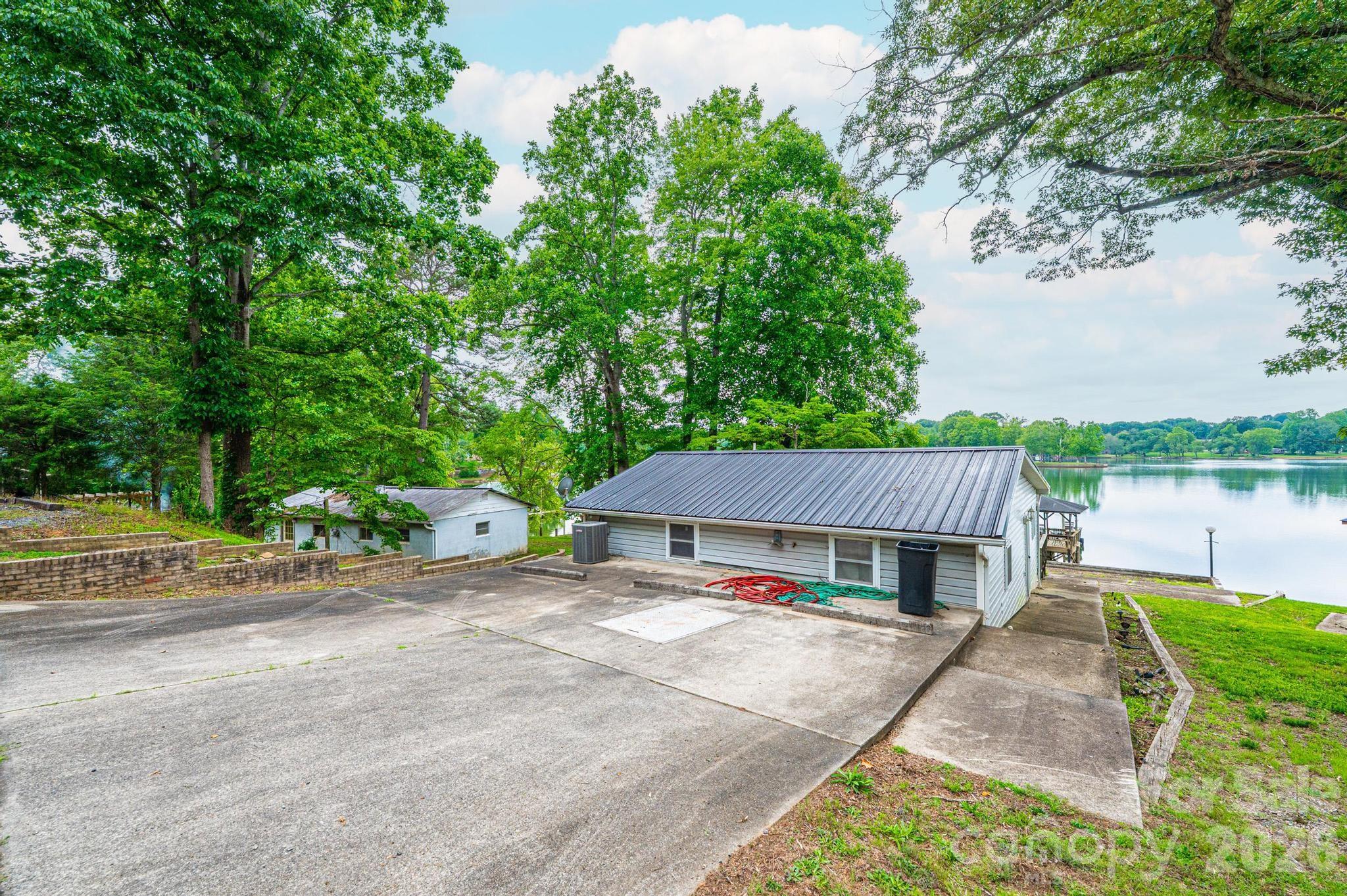 Lakefront retreat with endless potential. Wake up to breathtaking water views from this beautifully updated 2 bedroom, 1 bath lakefront home on Lake Lookout. Featuring a private pier, new appliances and numerous updates throughout, this property offers the perfect blend of comfort, relaxation and waterfront living. Enjoy stunning lake views from your home and take advantage of the lakefront lots that provide room to spread out and enjoy the outdoors. A second structure (630 usf) is ready for your vision and renovation. The owner believes the additional building shares the well and septic system with the main home. It also includes its own pier, though repairs and updates needed. Whether you are looking for a private getaway, multi generational living this property offers incredible possibilities.