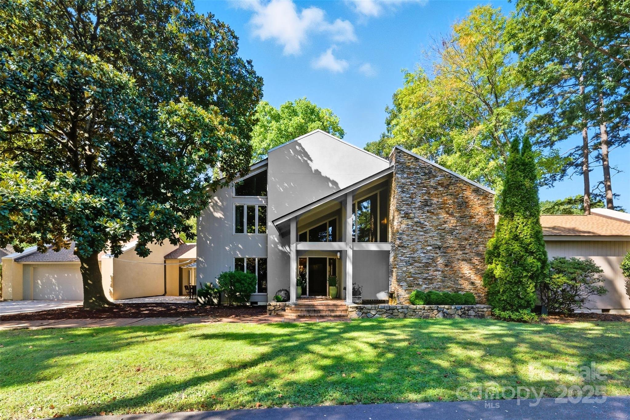 Modern Luxury on the 18th Hole | Panoramic Golf Course & Lake Views
Discover the pinnacle of contemporary living in this stunning 4,800 sq ft custom home, perfectly situated on nearly half an acre with commanding 180-degree views of the 18th hole, serene lake, and prestigious clubhouse. Designed for both grand entertaining and relaxed everyday living, this residence seamlessly blends modern architecture with resort-style surroundings.
Soaring ceilings and walls of windows flood the open-concept living spaces with natural light, framing picturesque vistas from every angle. The expansive floor plan features generous gathering areas, a gourmet kitchen, and seamless indoor-outdoor flow to covered patios and outdoor entertaining spaces.
Each of the spacious bedrooms is a private retreat, complete with its own en-suite bathroom—ideal for family or guests. Whether you're waking up to sunrise over the fairway or hosting sunset cocktails with the clubhouse as your backdrop, every moment here is unforgettable.
This is more than a home—it's a lifestyle. Welcome to elevated living on the course. Gated community, Beach, Marina playground and community garden..