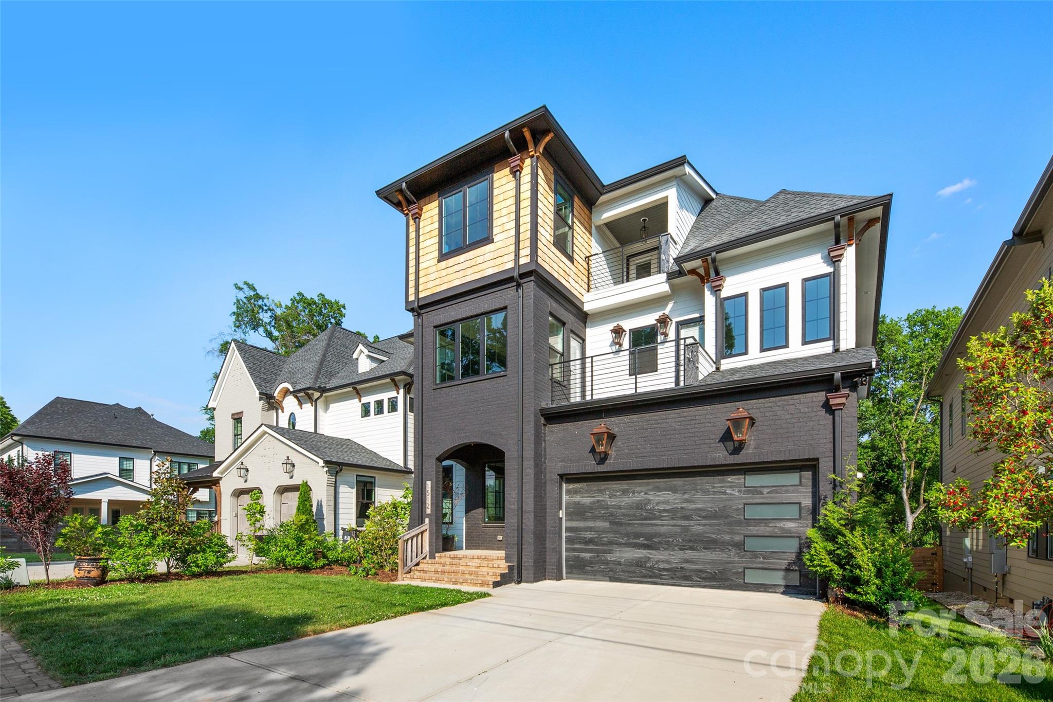 Gorgeous Custom 5 bedroom home located in the vibrant & sought after Belmont Neighborhood.  Each room is curated with a unique & show stopping Restoration Hardware, Pottery Barn, or Serena & Lily Fixture.  This home will take your breath away, as soon as you lay your eyes on its grandeur curb appeal.  You are drawn into the beauty with custom woodwork ceilings & a large cedar mantle surrounded by gorgeous sconces in the living room.  The chefs kitchen is absolutely stunning including a butlers pantry with nothing left out including and not limited to Marble countertops, Marble backsplash, a La Cornue Stove, Free standing Subzero Refrigerator, Free standing Subzero Freezer, & Hoshizaki ice machine.  The expansive primary suite has an incredible walk-in closet alongside a spa ready bathroom with double shower heads, marble counter double sinks, & gorgeous marble flooring.  Kick off your shoes on your Extra-Wide plank, Solid wood, White Oak flooring and enjoy a relaxing moment under your covered deck fireplace staring off into your Large wooden Fenced in Yard.  A moment to treasure from every front deck and bedroom in the evening is the gorgeous Charlotte Skyline City view, Nothing was spared, down to the Woodbridge toilets and Navien tankless water heater.    This home will not last; it's not just a house it is truly a forever home ready to make everlasting memories.  Come and see for yourself!