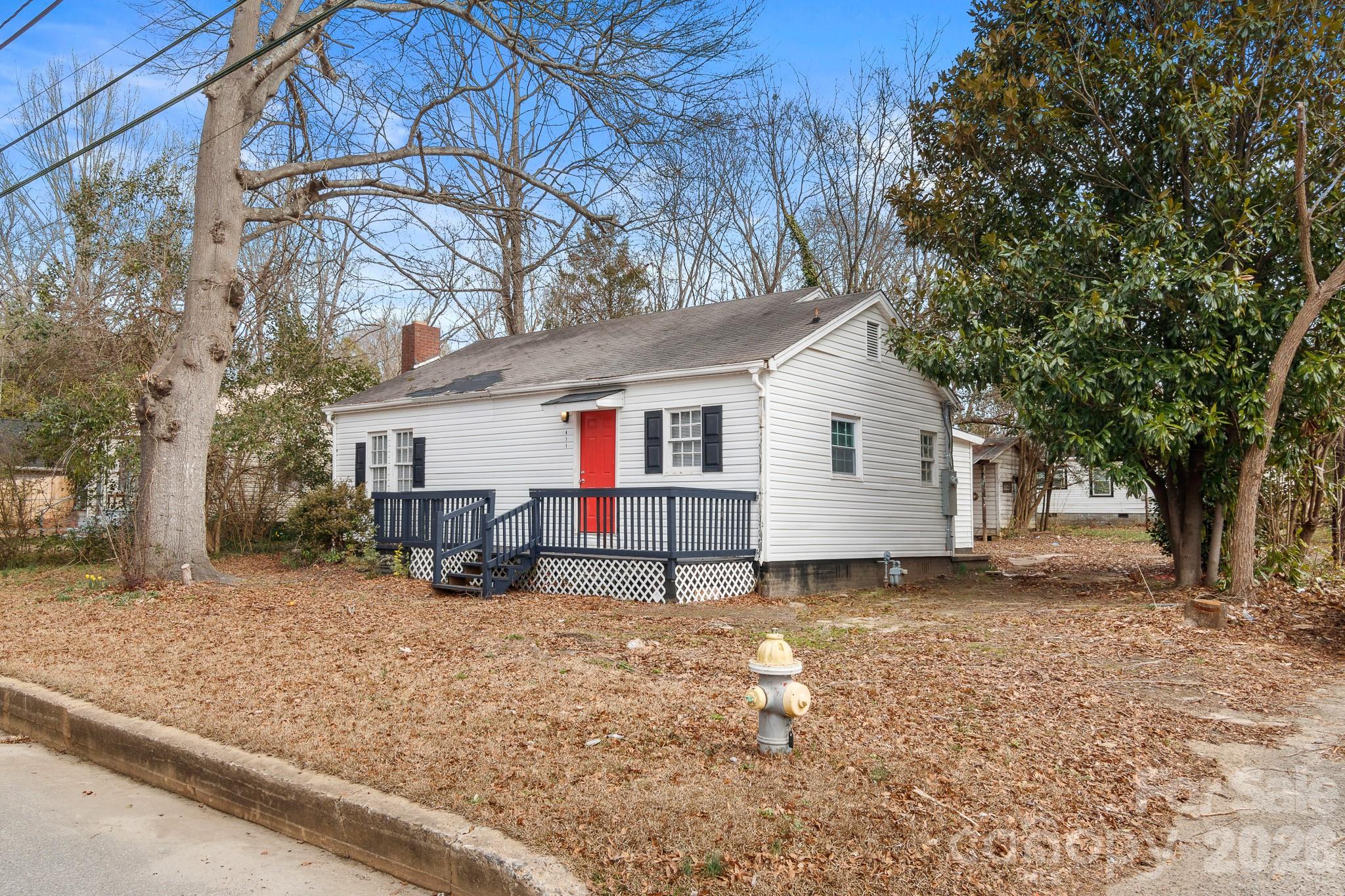 This beautifully updated 3BR/2BA home sits on a corner lot just 1 mile from Uptown Shelby and features new living room flooring, a newer water heater (2024), plus a crawlspace moisture system and transferable termite warranty from a local contractor. The open-concept living and kitchen area offers abundant cabinet and counter space, while the split-bedroom layout provides a private primary suite with an en-suite bath. Relax on the large front porch, and take advantage of the detached 259 sq. ft. outbuilding—perfect for a workshop!